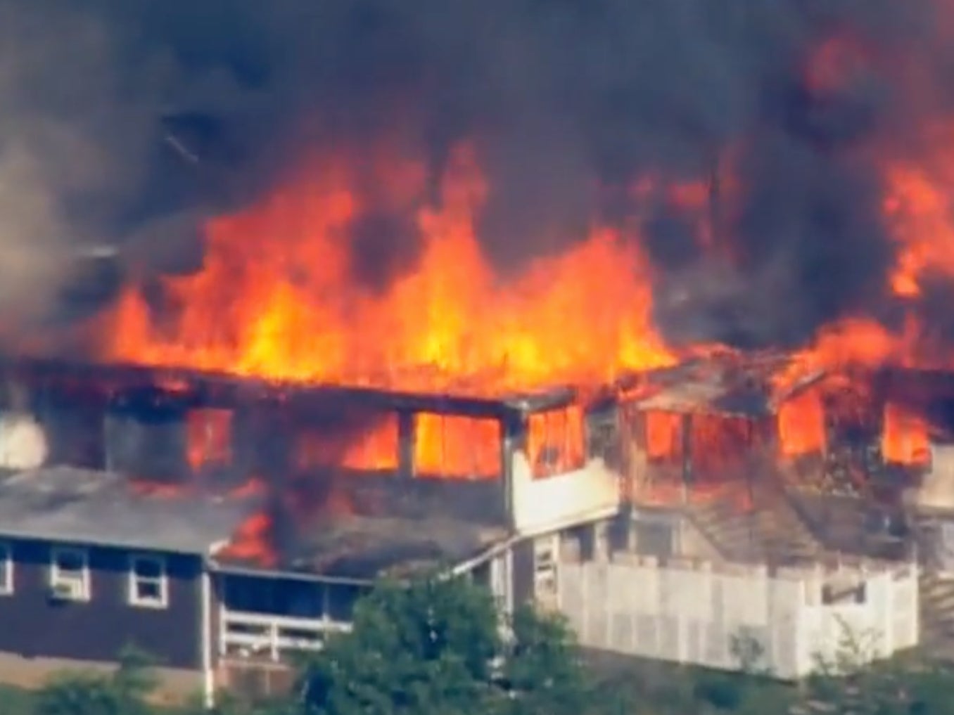 Flames pour out of the dining hall at Camp Airy, a Jewish boys summer program in Maryland.