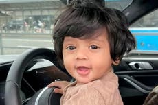 Baby’s stunning mop of black hair definitely not a wig, mother says