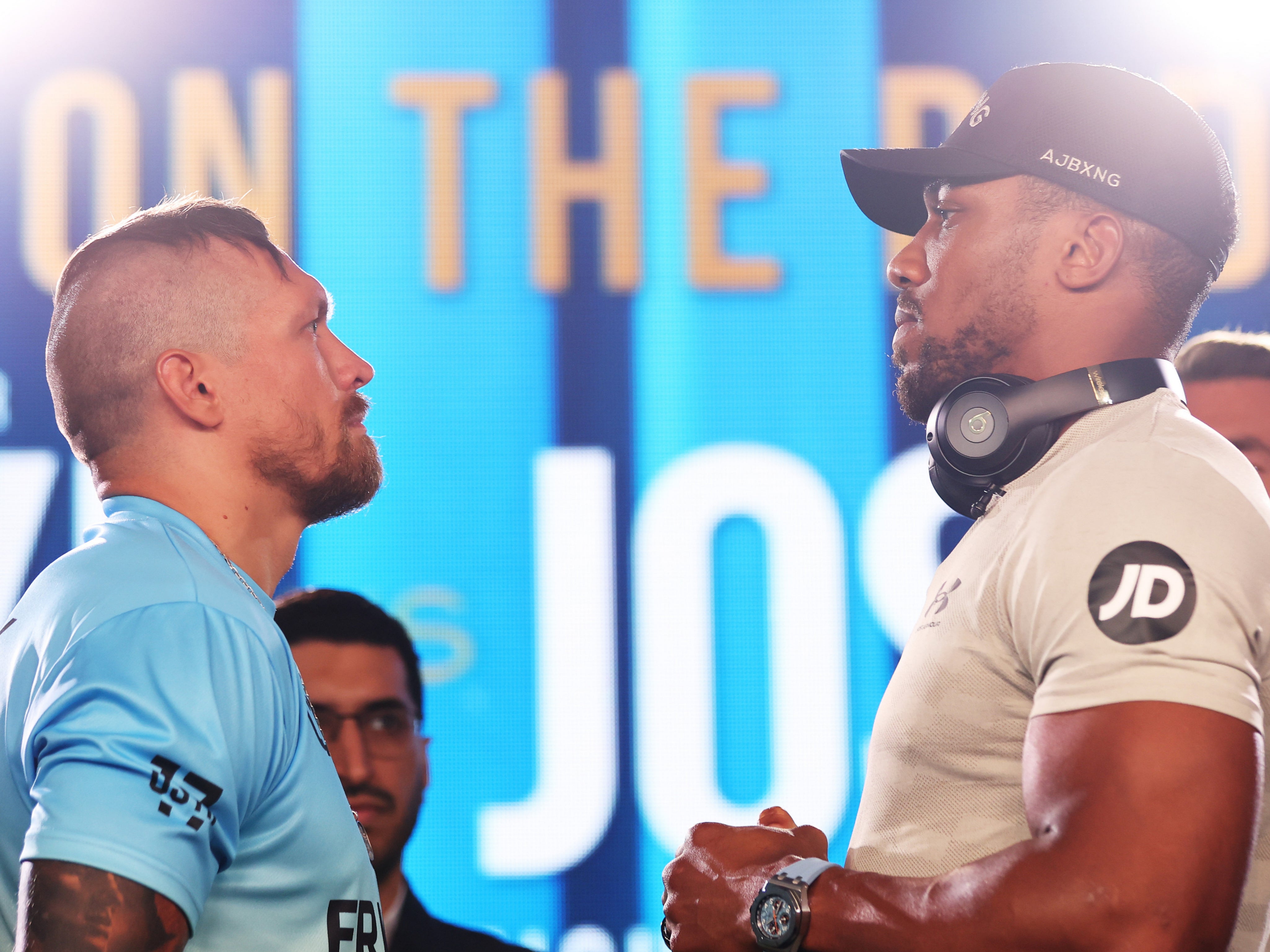 Oleksandr Usyk (left) and Anthony Joshua face off in London