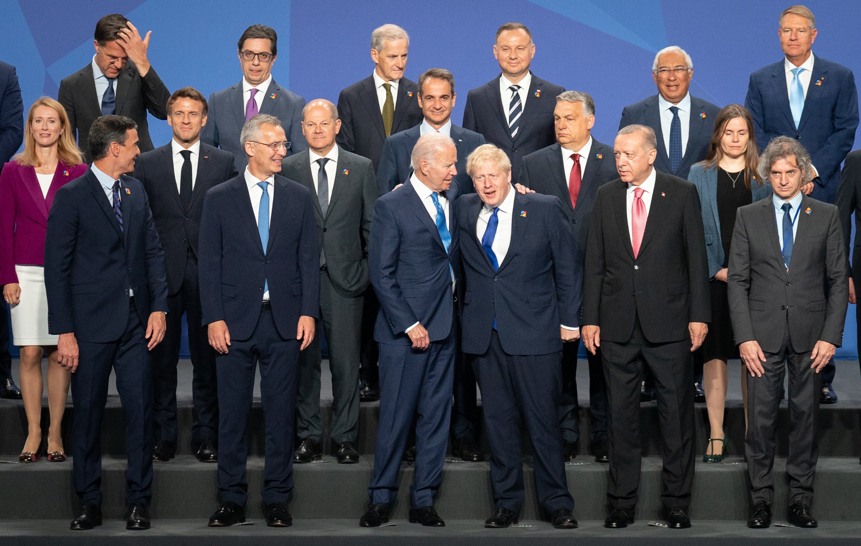 Prime Minister Boris Johnson stands beside US President Joe Biden and other world leaders posing for a family photo during the Nato summit in Madrid, Spain (Stefan Rousseau/PA)