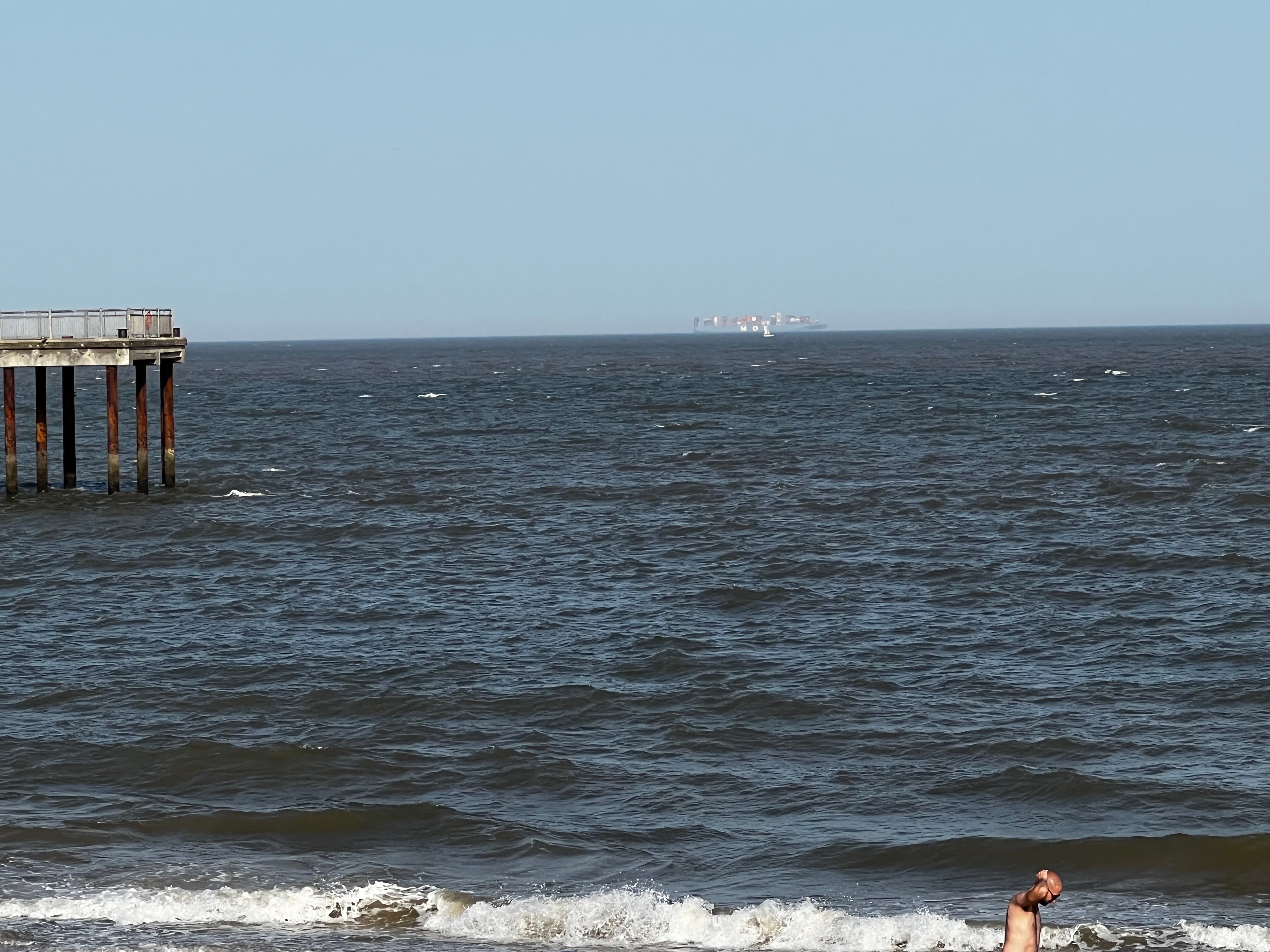 A large container ship on the horizon off the coast of Southwold, Suffolk