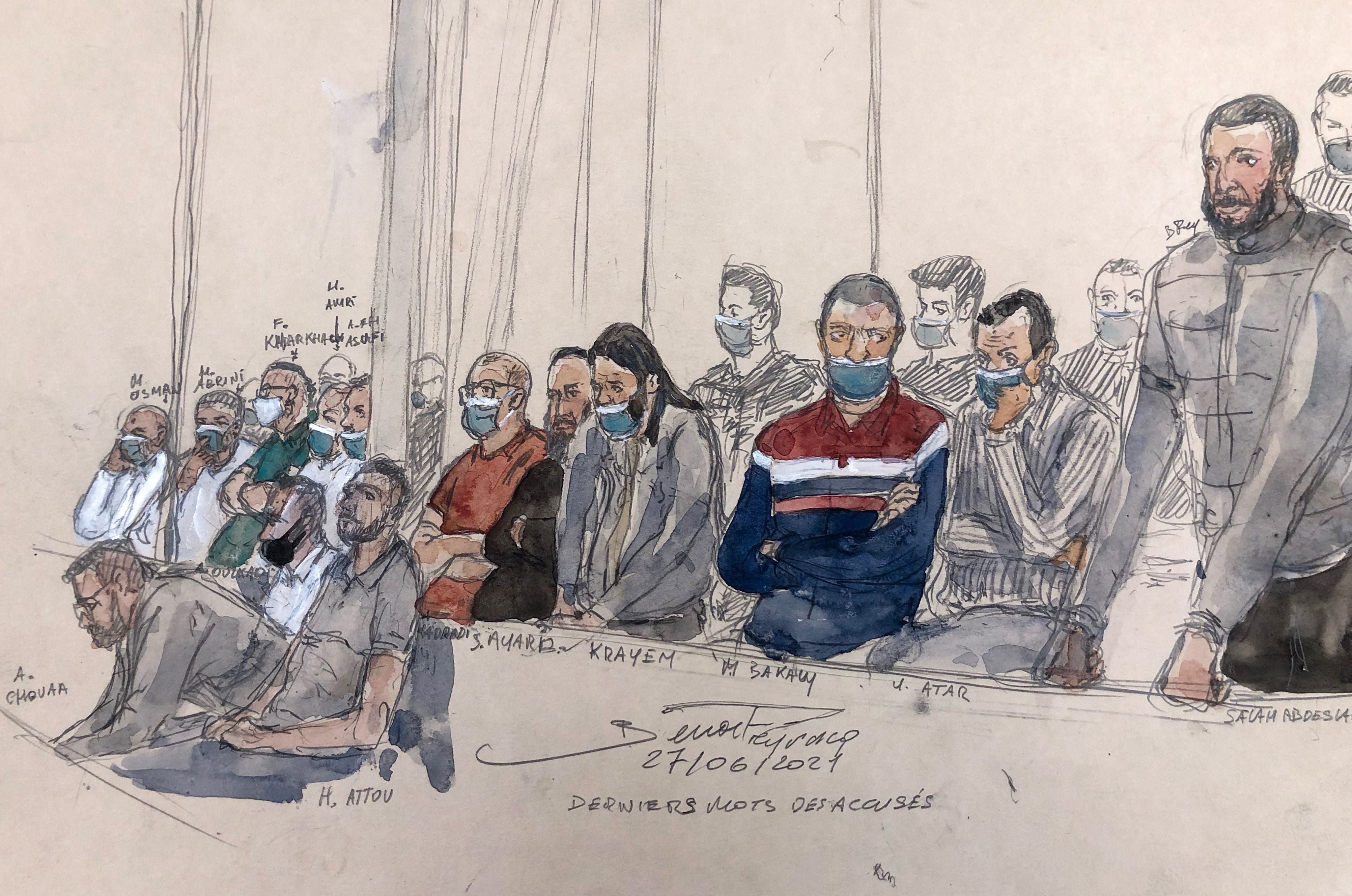 This court sketch shows defendant Salah Abdeslam (right) standing next to the 13 other defendants in front of the Paris court