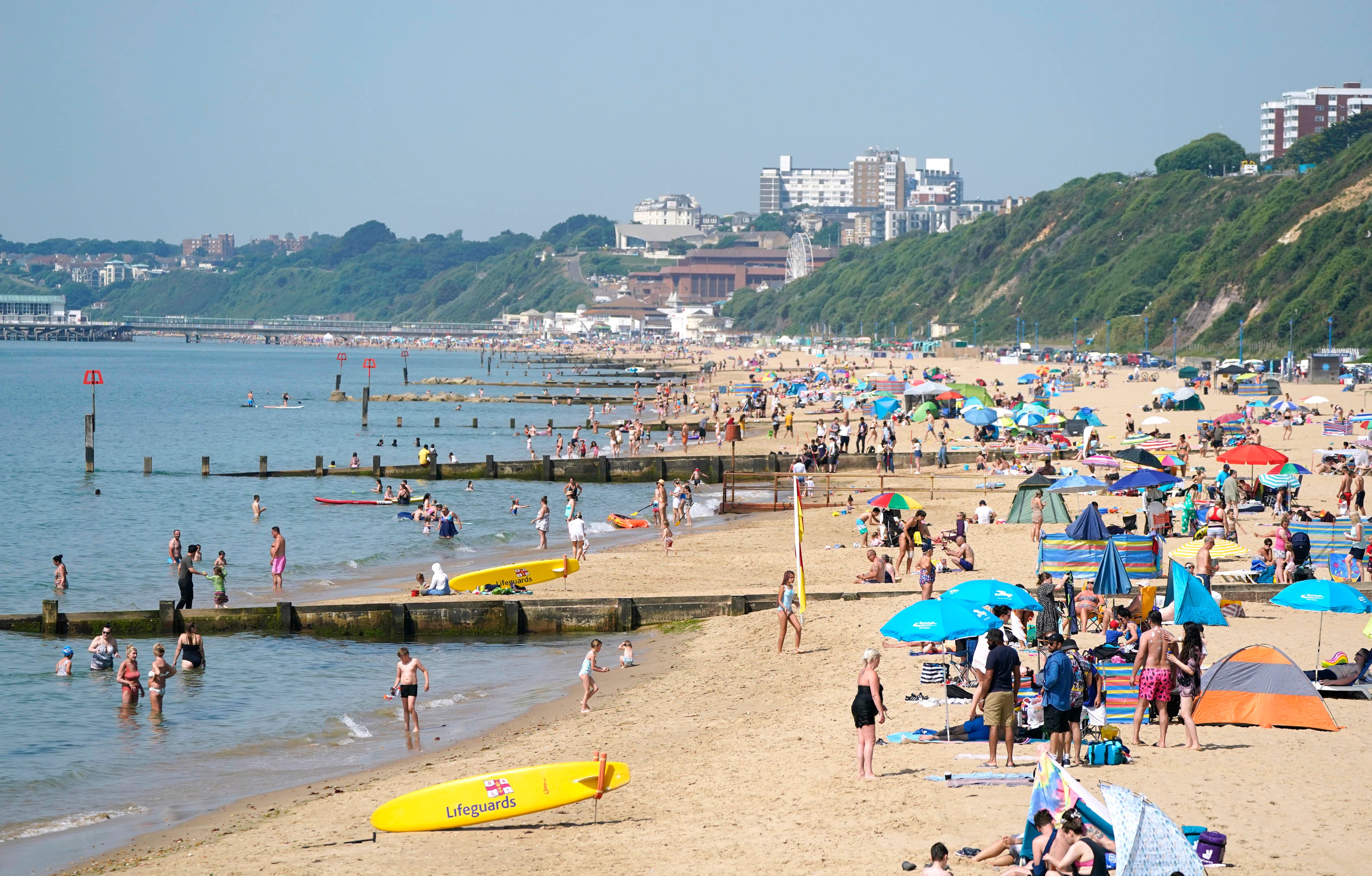 Britons relax in the hot weather on Boscombe Beach in Dorset in June as temperatures reached a sweltering 34C