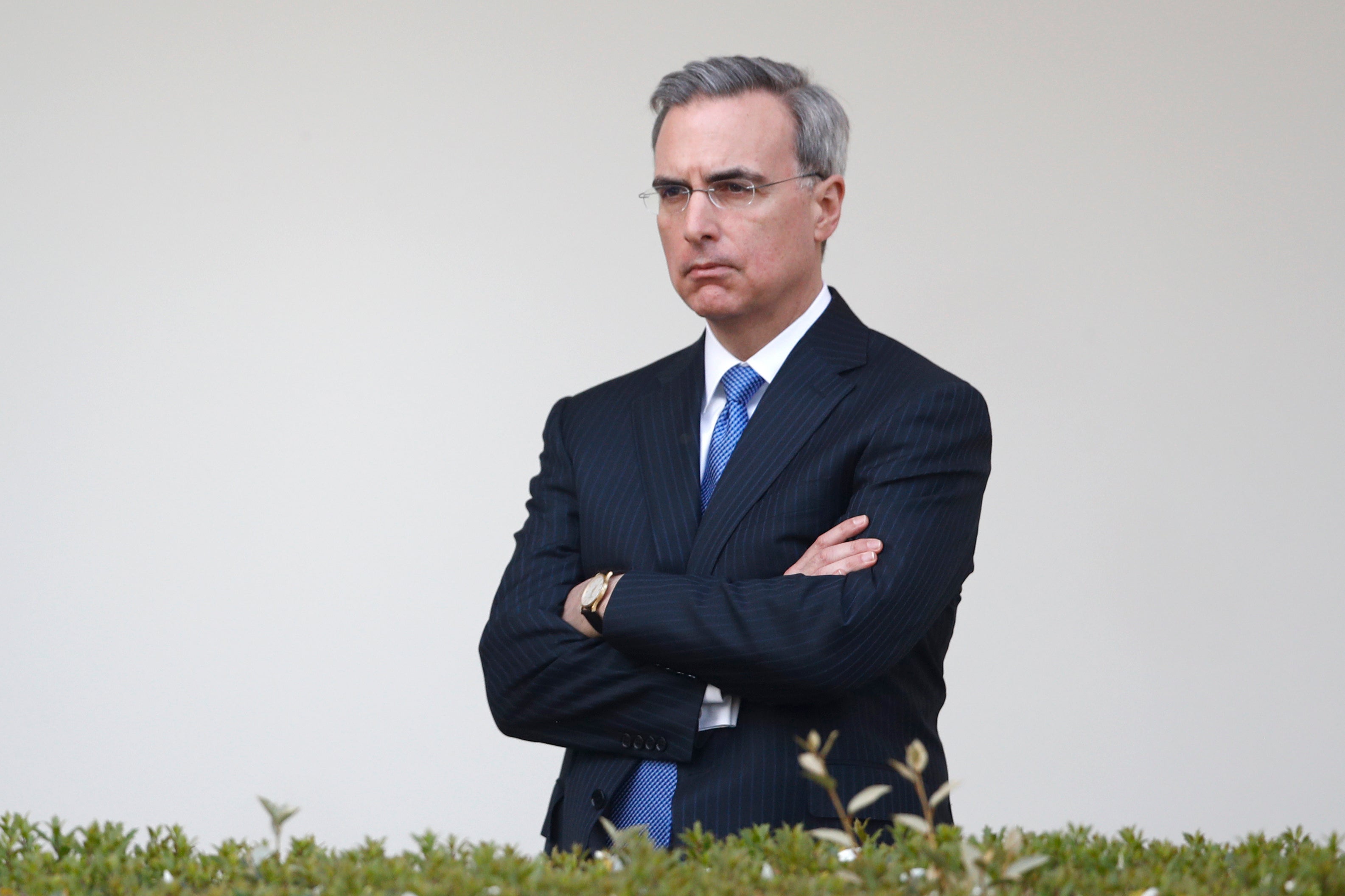 White House counsel Pat Cipollone listens as President Donald Trump speaks during a coronavirus task force briefing in the Rose Garden of the White House, March 29, 2020, in Washington