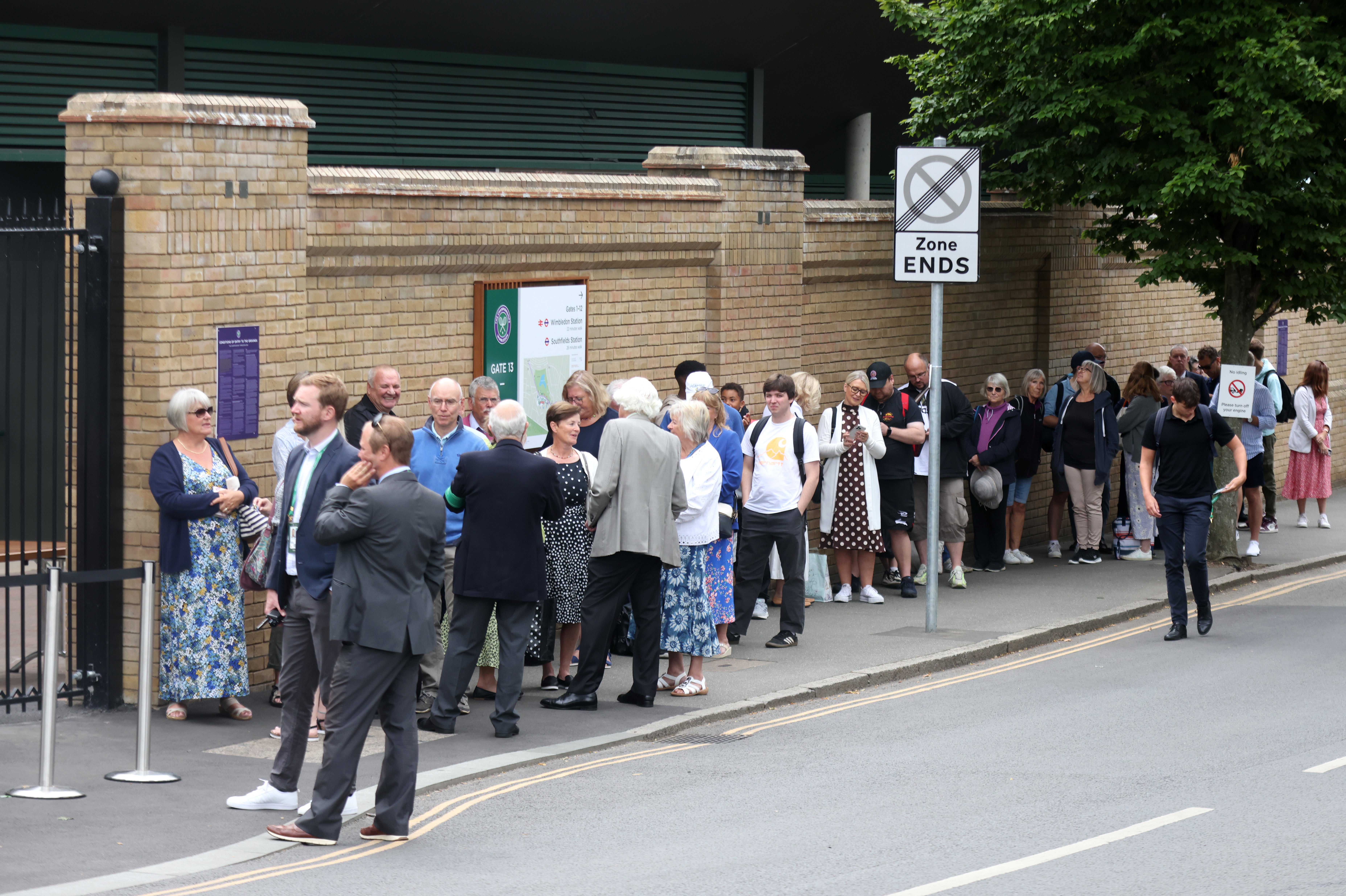 People wait in a queue to get entry to the Wimbledon Championships on June 29 2022 (James Manning/PA)