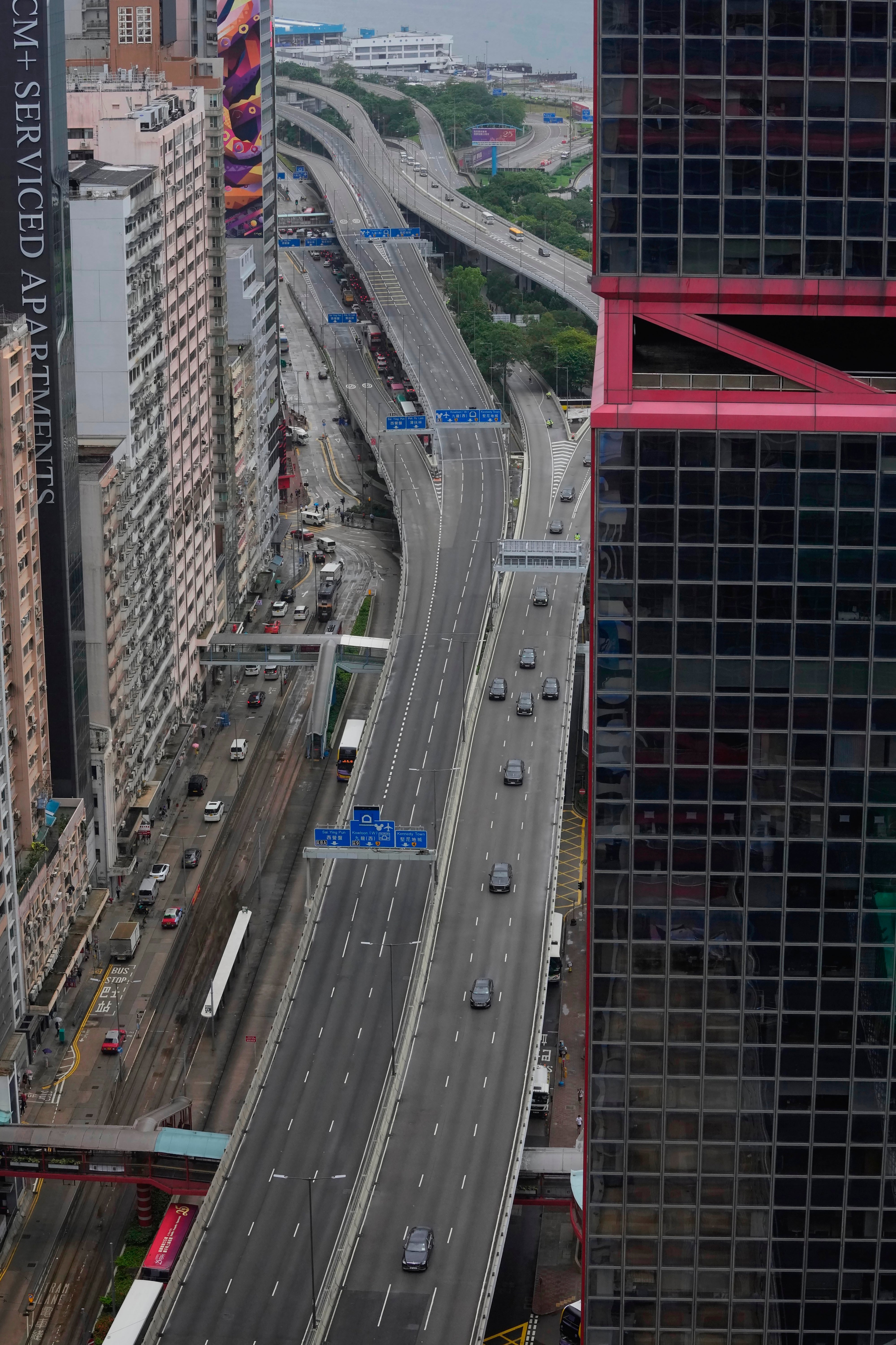 A convoy of China’s president Xi Jinping drives past as he arrives to mark the 25th anniversary of the handover