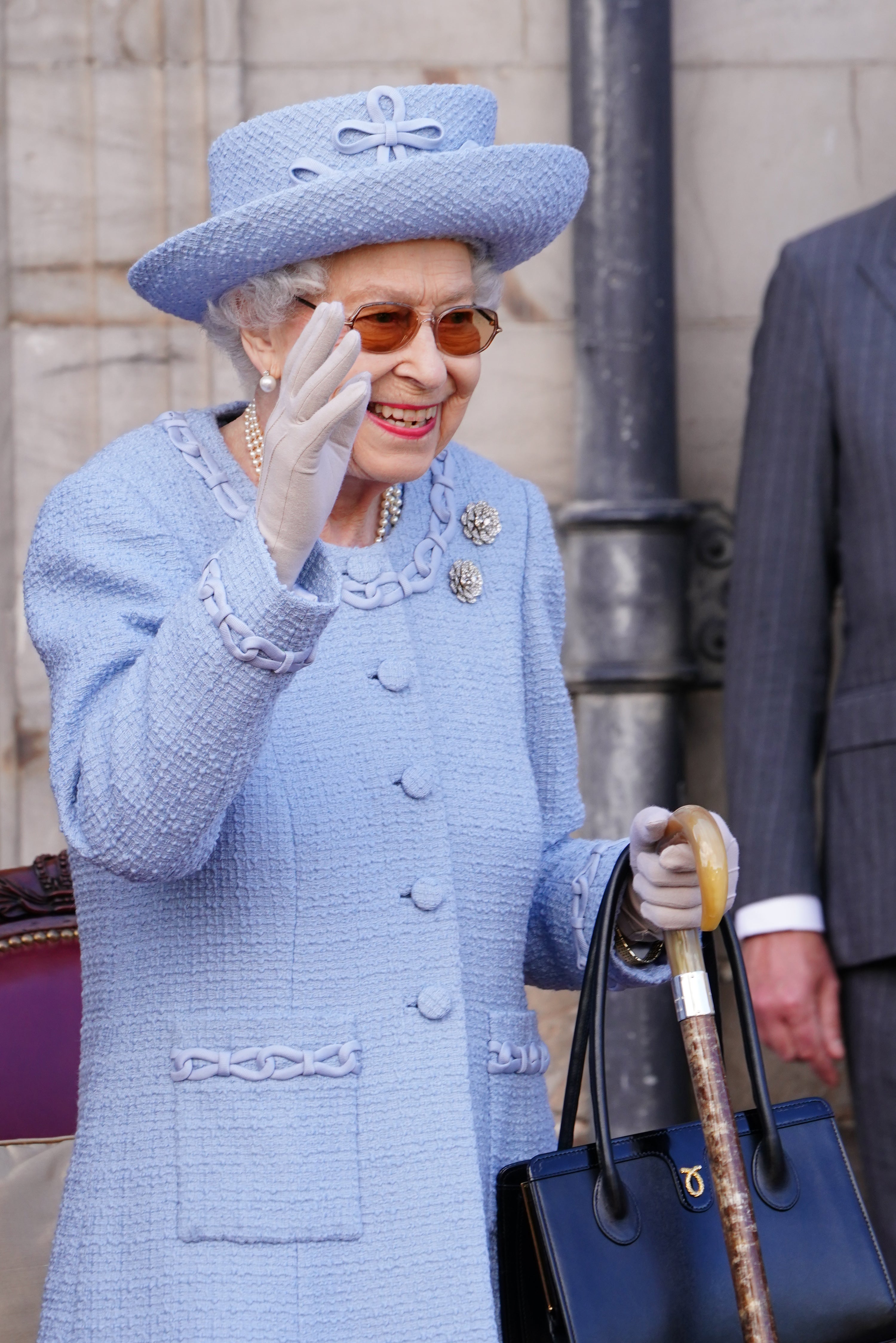 The Queen smiled and waved as she took in the ceremony at the Palace of Holyroodhouse (Jane Barlow/PA)