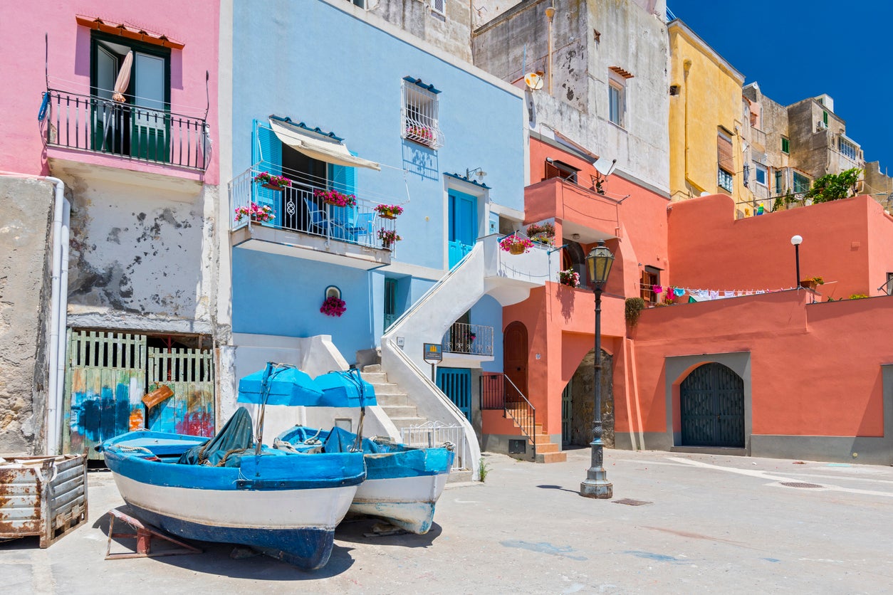 The marina is stacked with pretty, pastel fisherman’s cottages