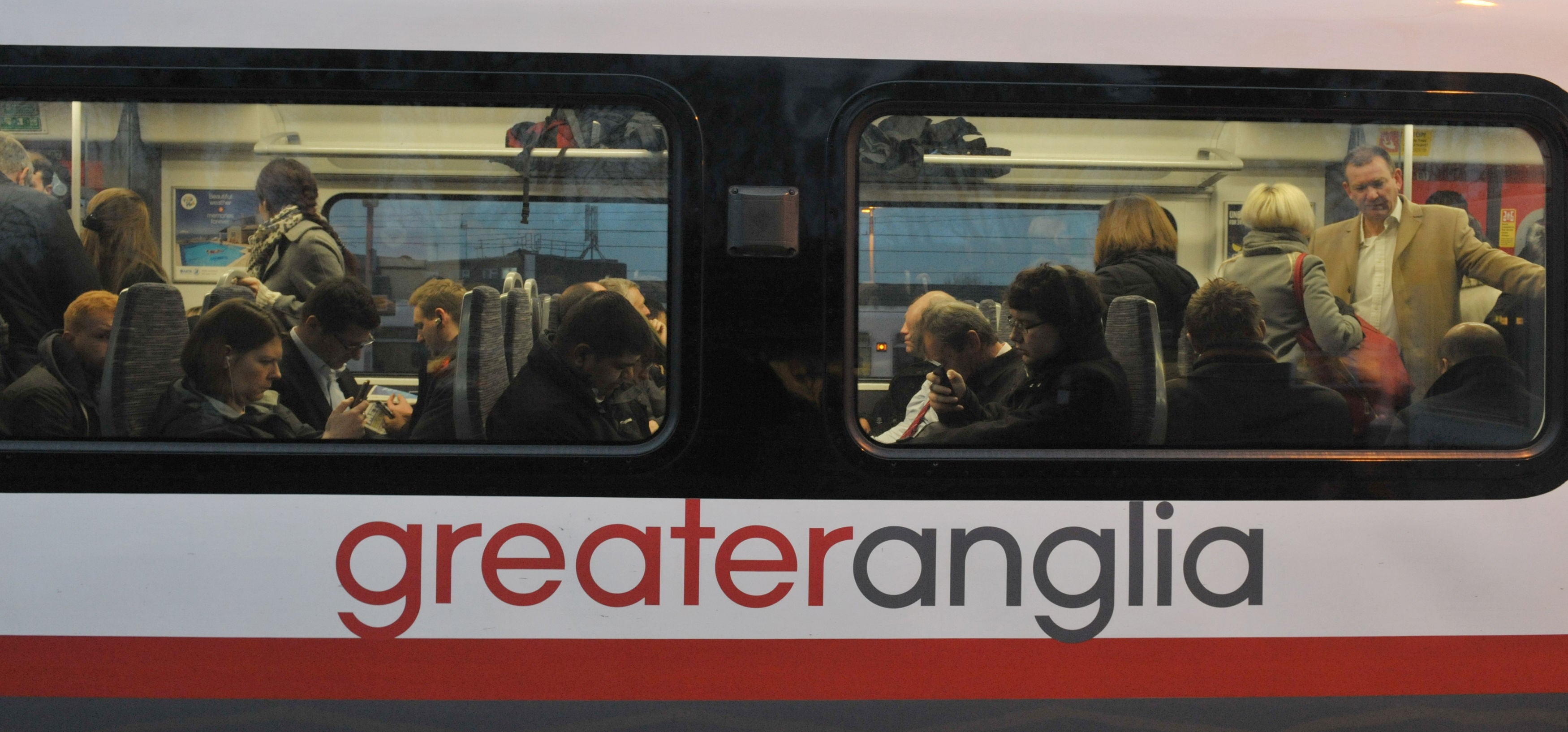 Commuters on board a Greater Anglia train (Nick Ansell/PA)