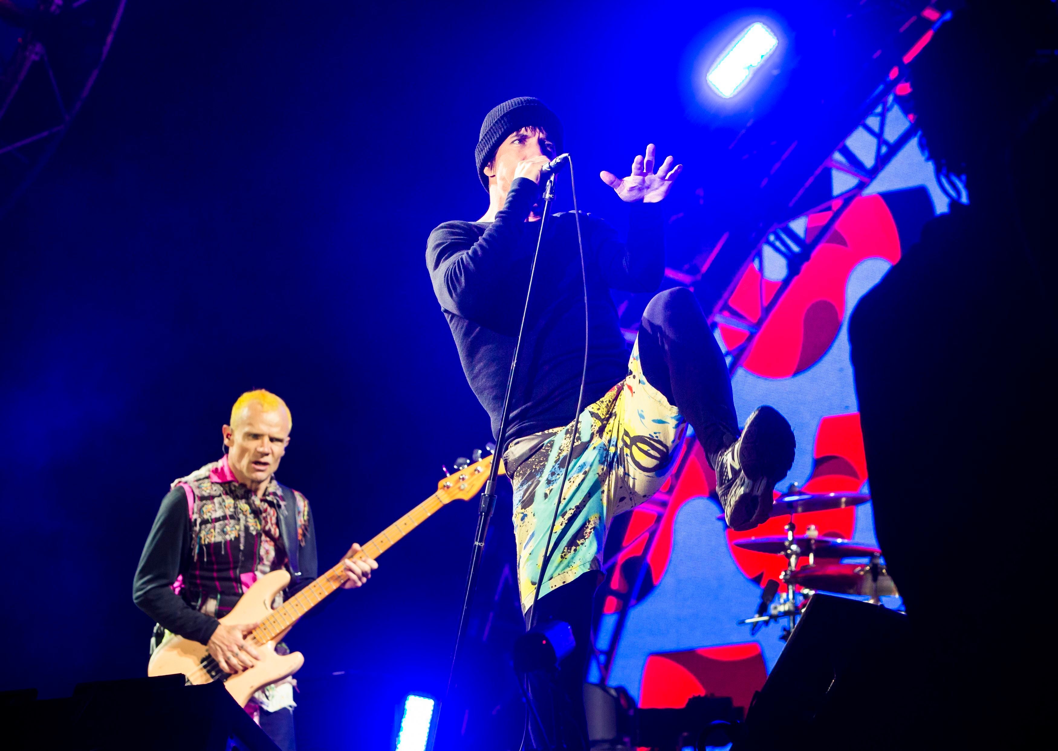 Red Hot Chili Peppers lead singer Anthony Kiedis (right) with bassist Flea (left) as they perform during the Leeds Festival at Bramham Park, West Yorkshire (Danny Lawson/PA)