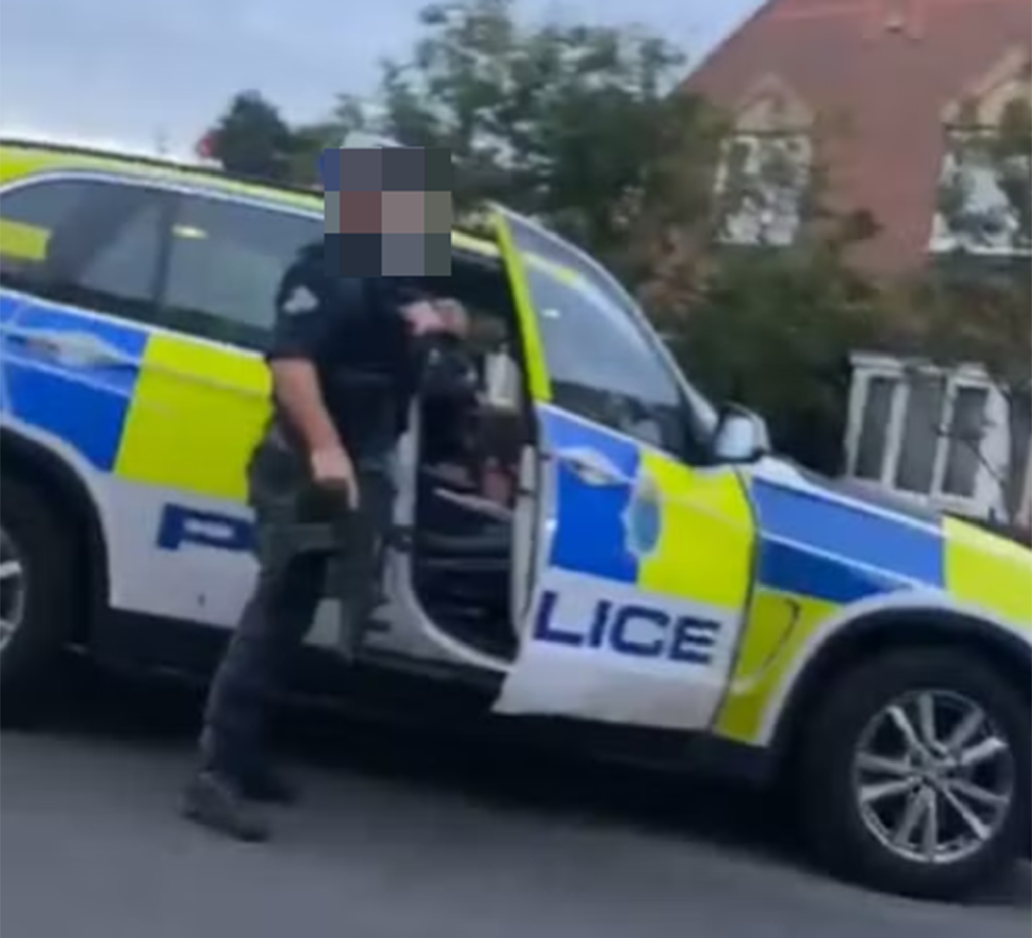 Officers could be seen with guns crowding the young men