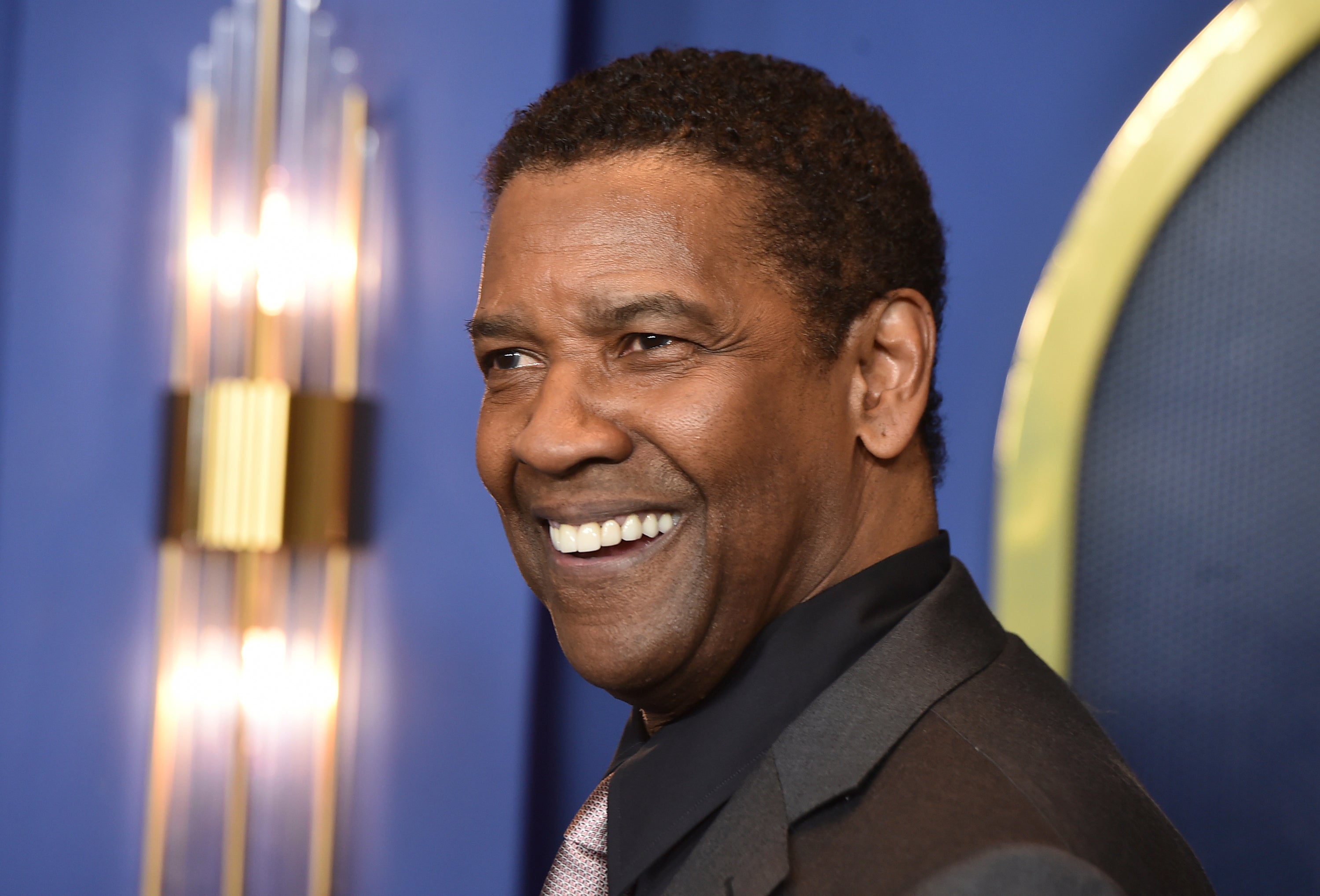 Denzel Washington arrives at the 94th Academy Awards nominees luncheon, March 7, 2022, in Los Angeles