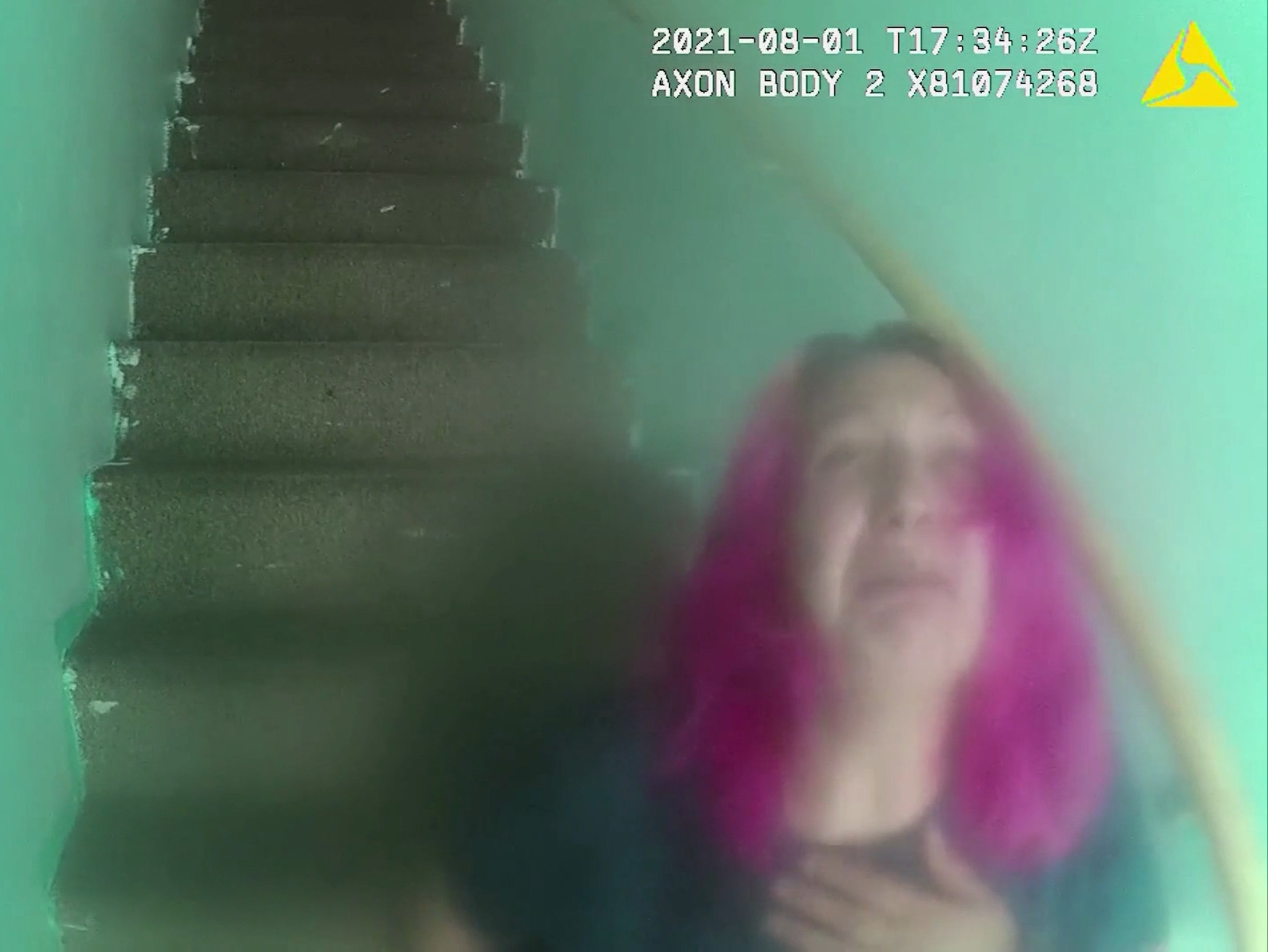 Angharad Williamson can be seen with bright pink hair in police body-worn camera footage from the day he was arrested on suspicion of murdering her five-year-old son