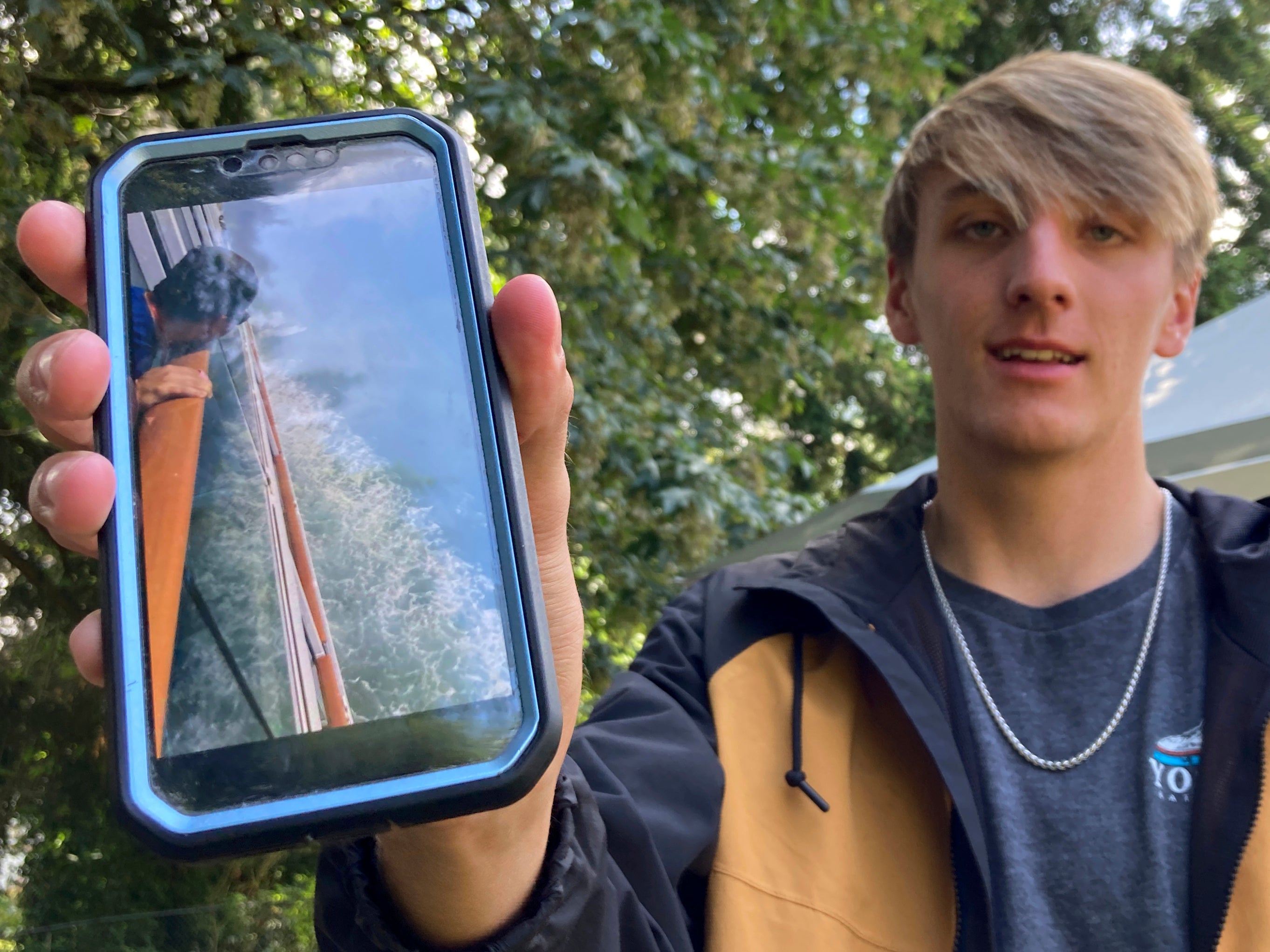 Las Vegas resident Benjamin Talbott poses with his phone at the home of a relative in Renton, Wash., on Thursday, June 30, 2022