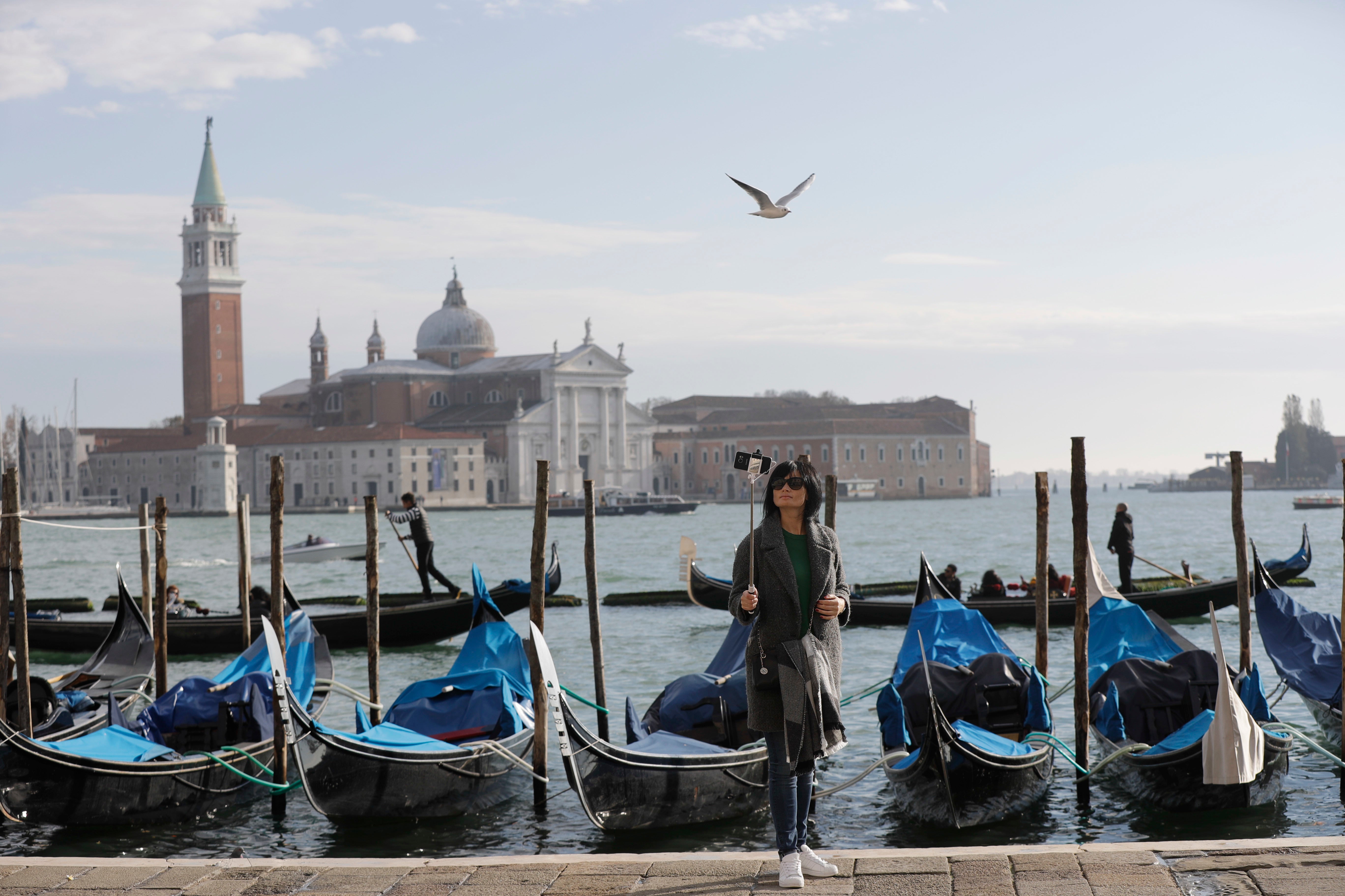 Roughly four-fifths of all tourists come to Venice just for the day