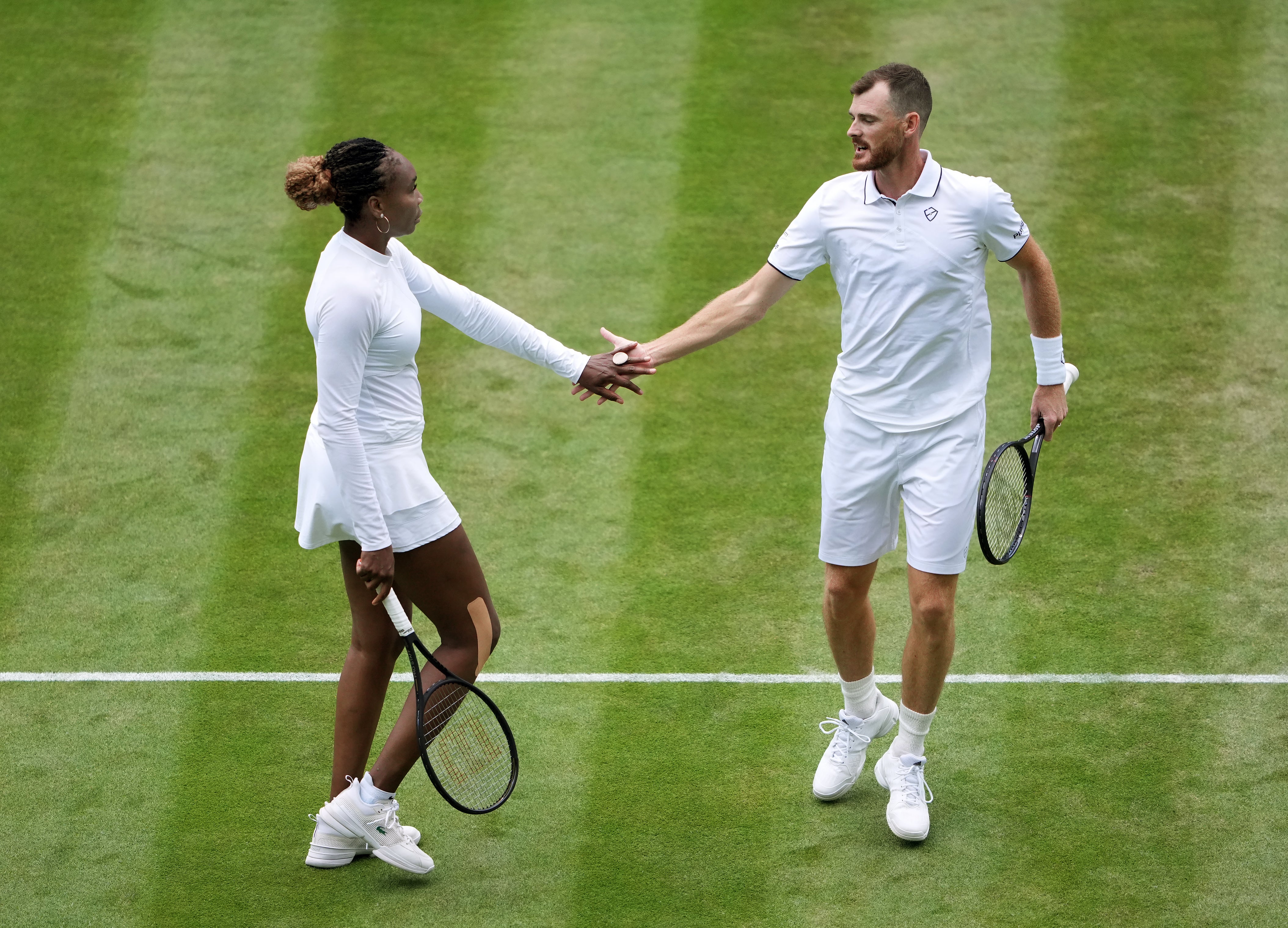 Venus Williams and Jamie Murray celebrate a point (Zac Goodwin/PA)