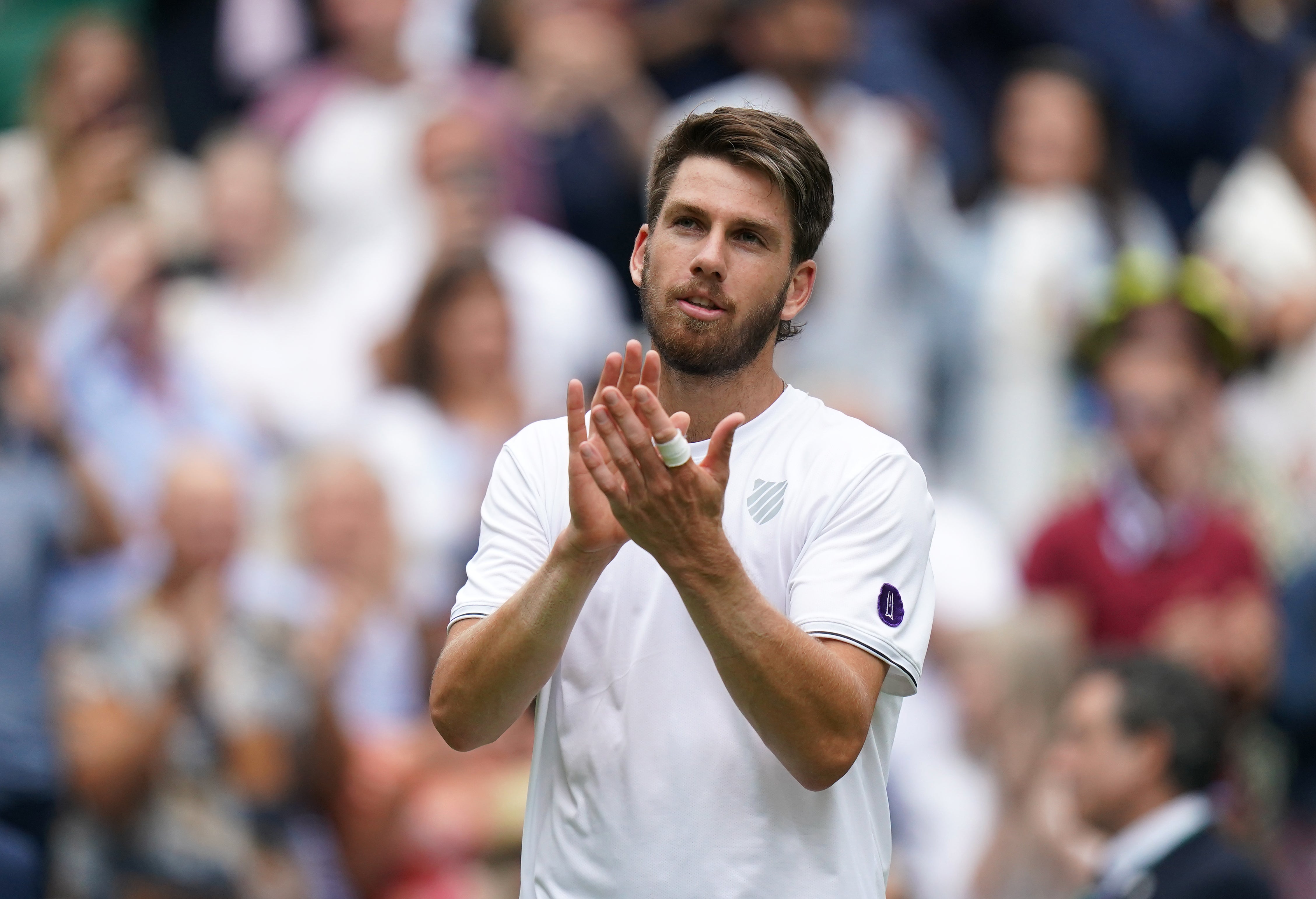 Cameron Norrie applauds the fans after winning his third round match against Steve Johnson (Adam Davy/PA)