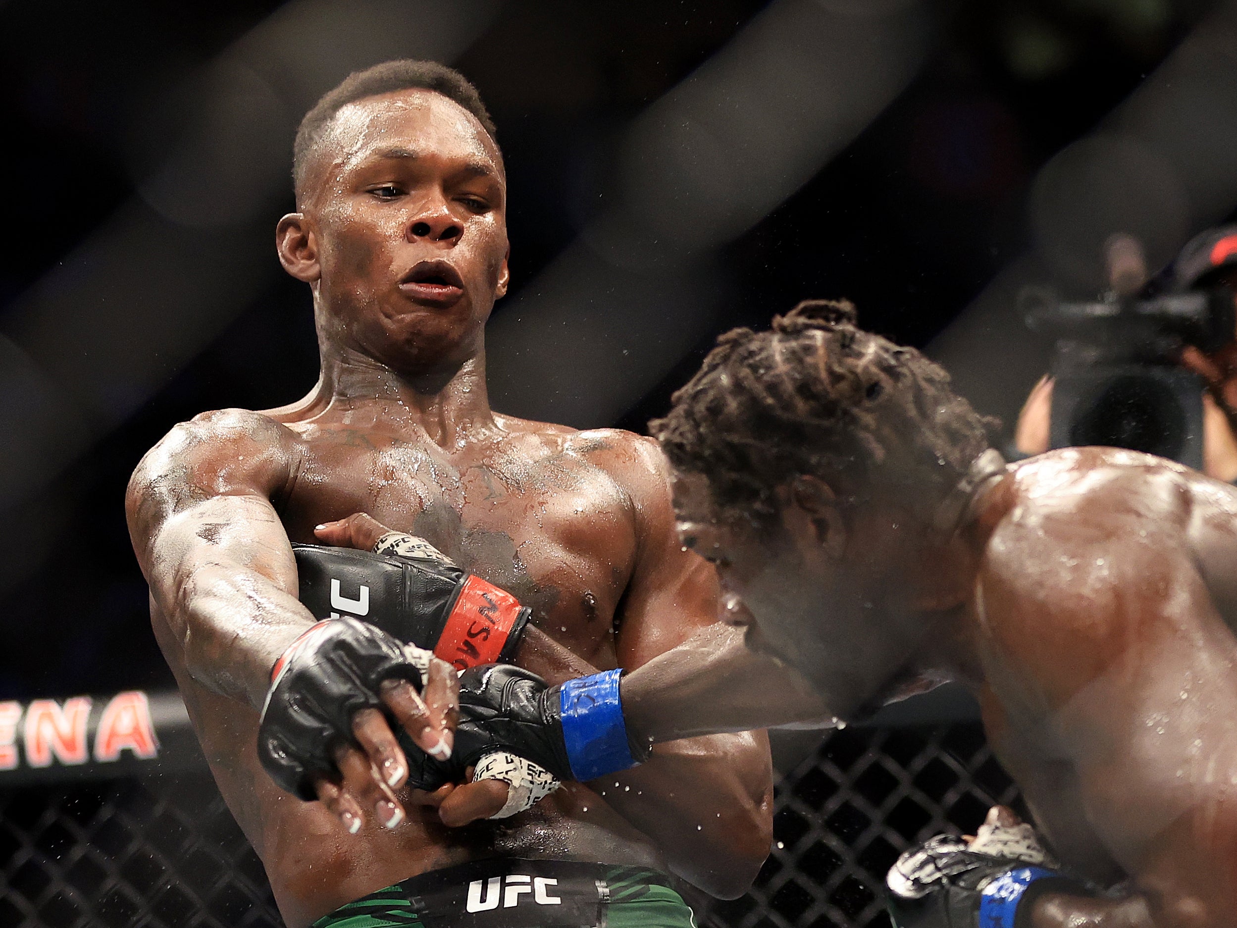 Israel Adesanya (left) outpointed Jared Cannonnier comfortably to remain middleweight champion