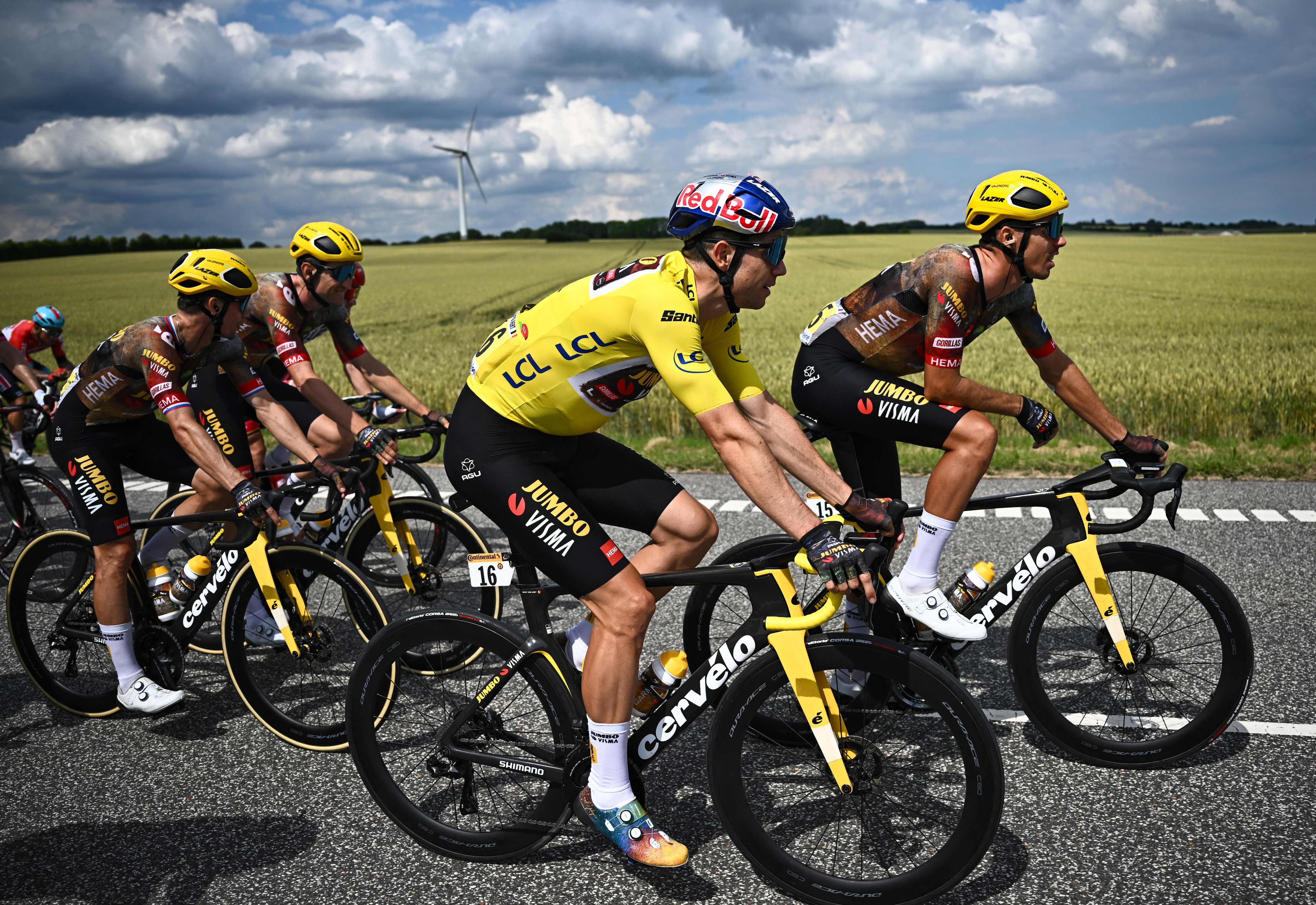 Wout van Aert riding alongisde his Jumbo-Visma teammates