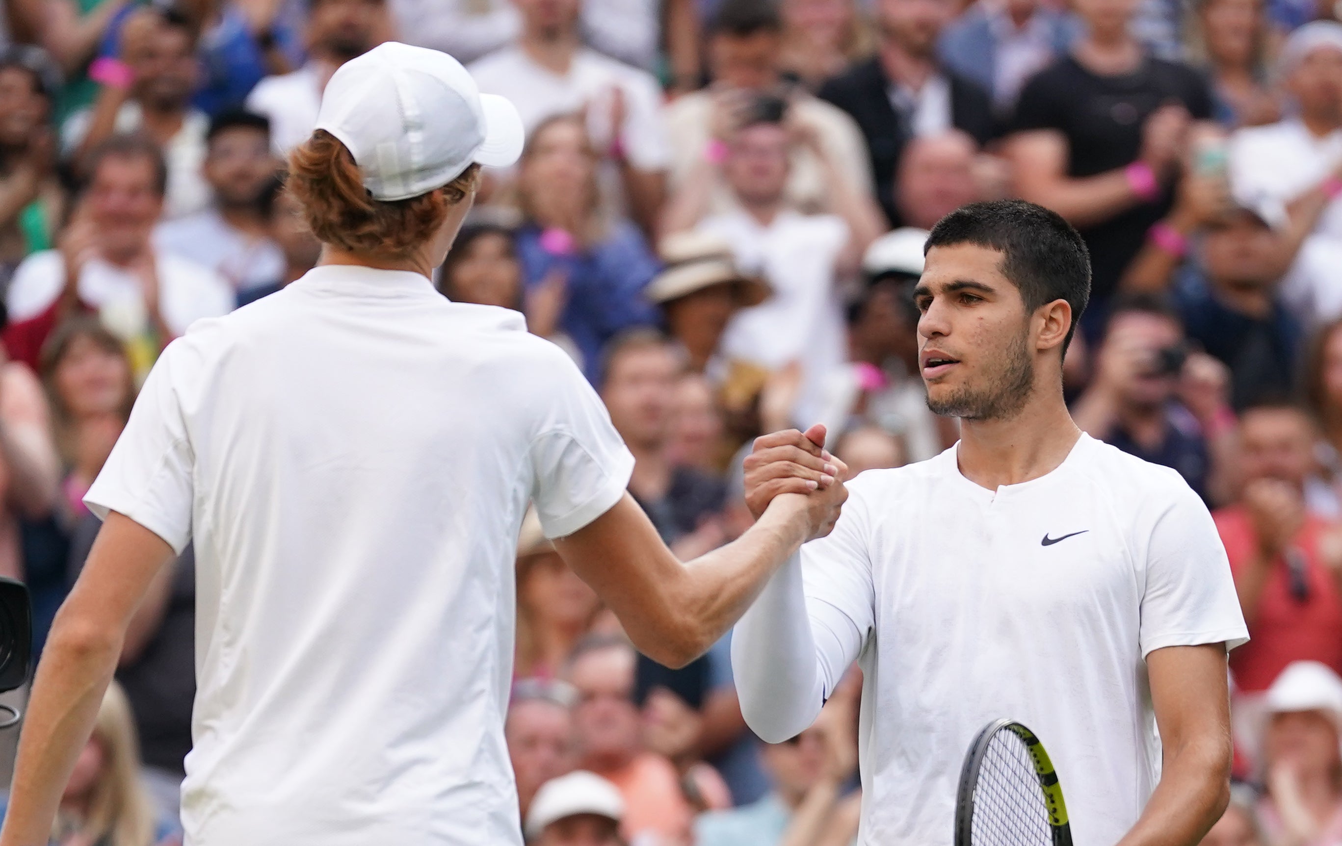 Jannik Sinner (left) shakes hands with Carlos Alcaraz (Adam Davy/PA)