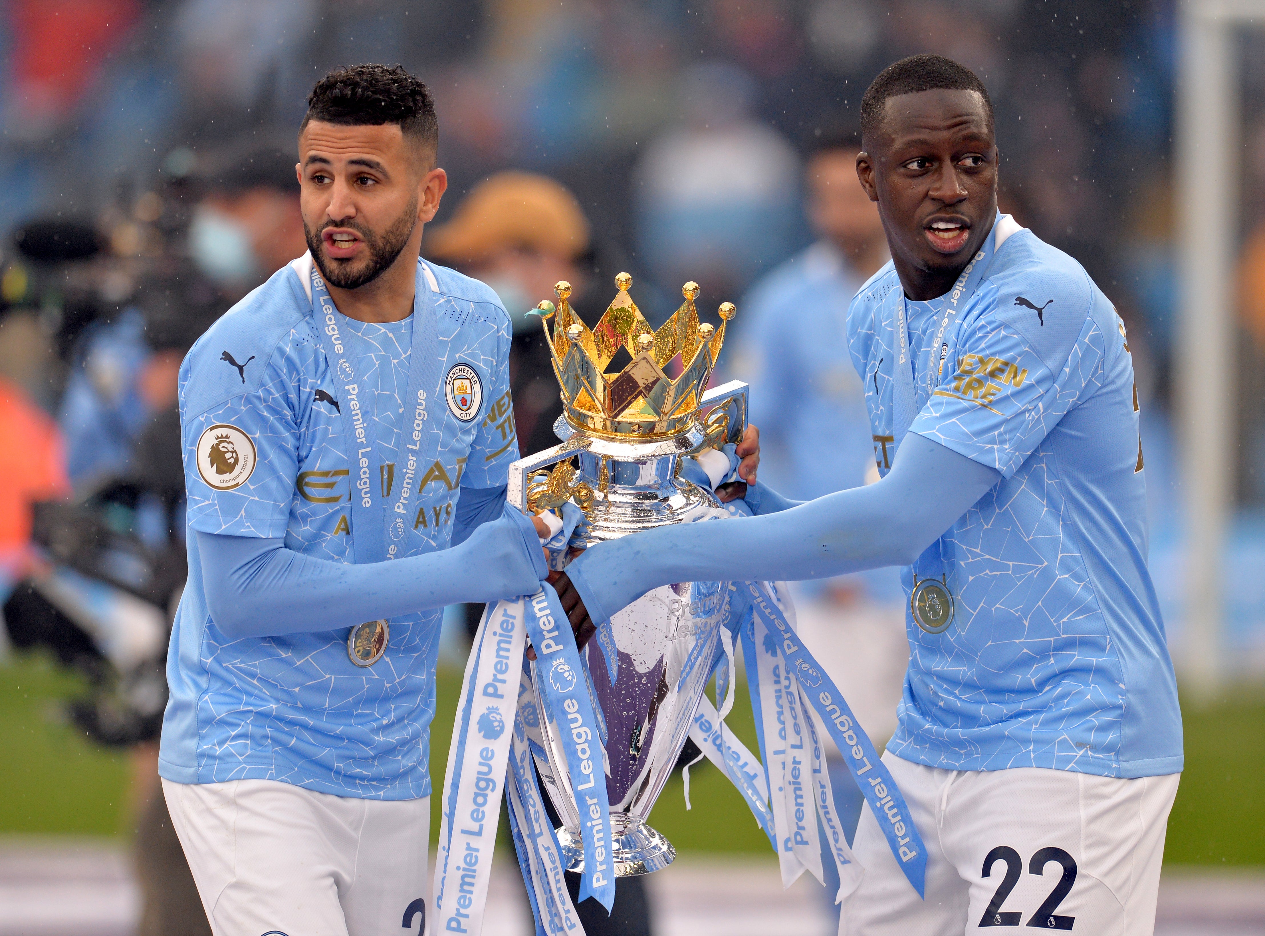 Riyad Mahrez, left, and Benjamin Mendy celebrate the Premier League title (Peter Powell/PA)