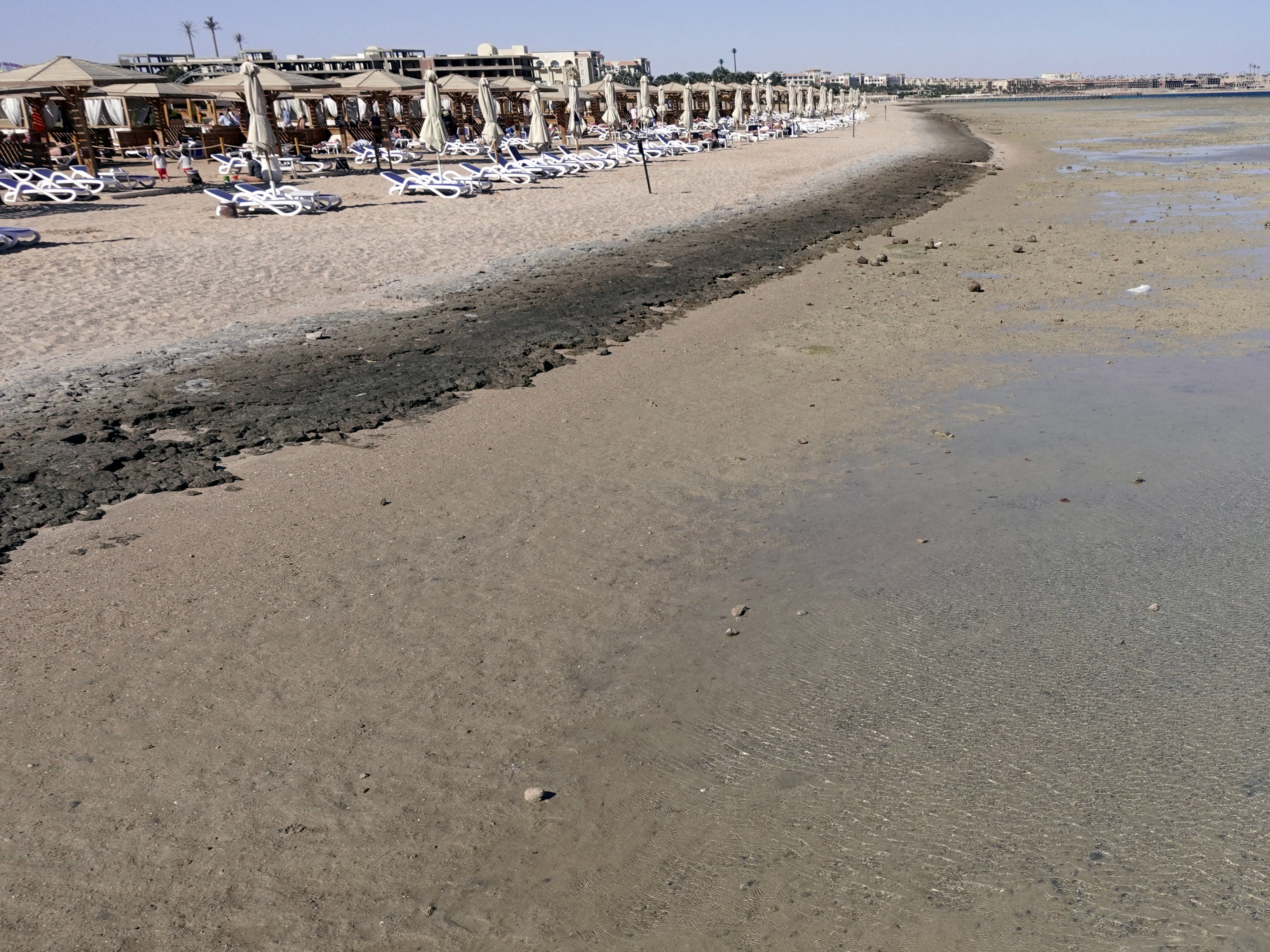 Empty sunbeds are seen during a low tide at the beach of the Red Sea resort of Sahl Hasheesh, Hurghada