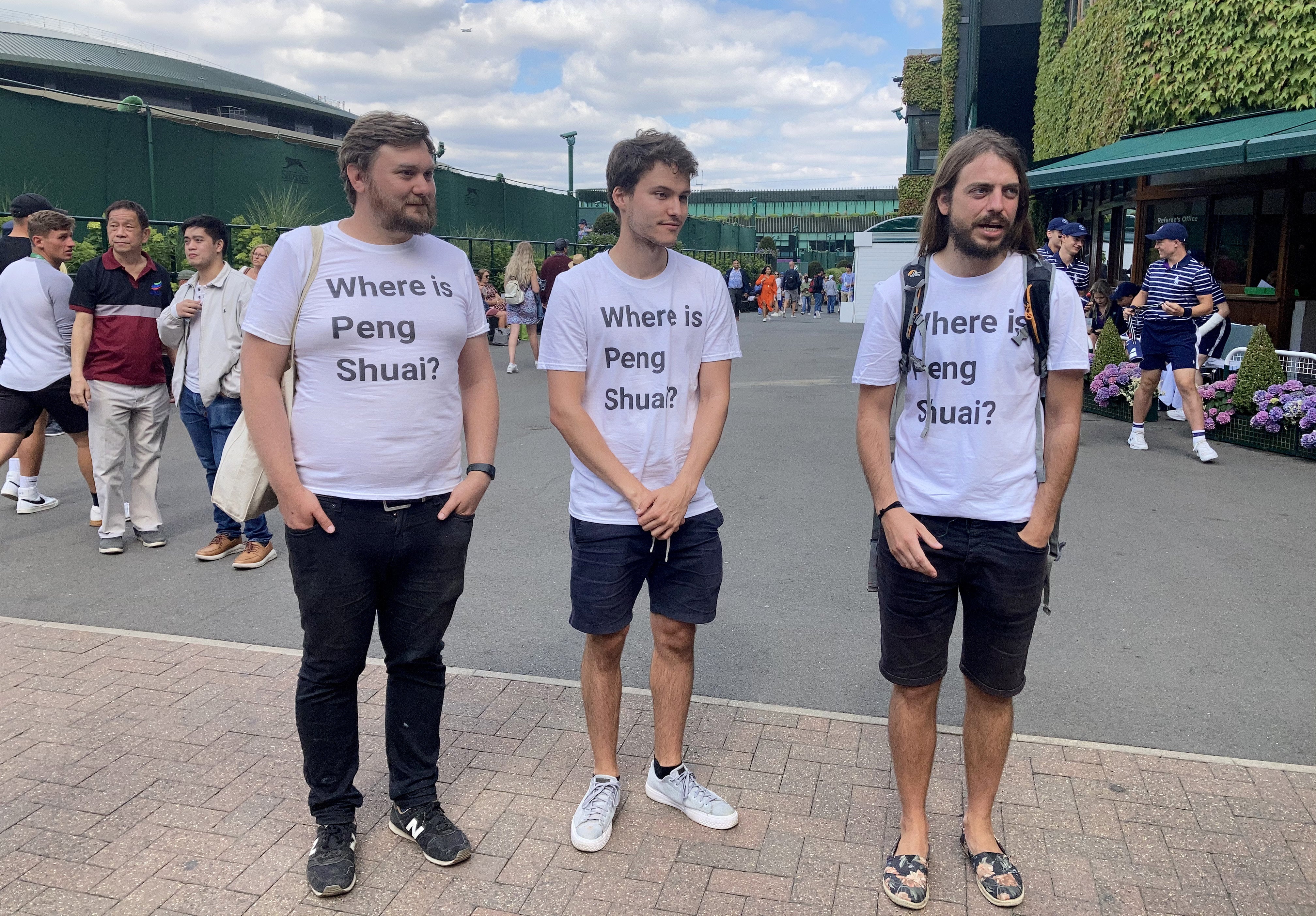 Protesters (left to right) Will Hoyles, 39, Caleb Compton, 27, and Jason Leith, 34, who all work for Free Tibet who have come to Wimbledon to draw attention to Peng Shuai (Rebecca Speare-Cole/PA)