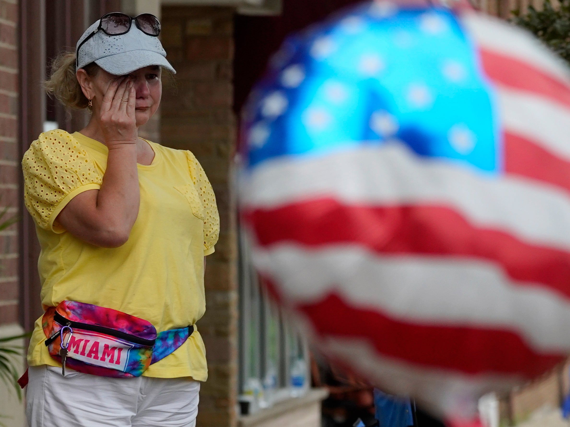 Six people were killed and at least 36 more injured after a gunman perched on a rooftop opened fire on families waving flags and children riding bikes at the Independence Day event in the Chicago suburb