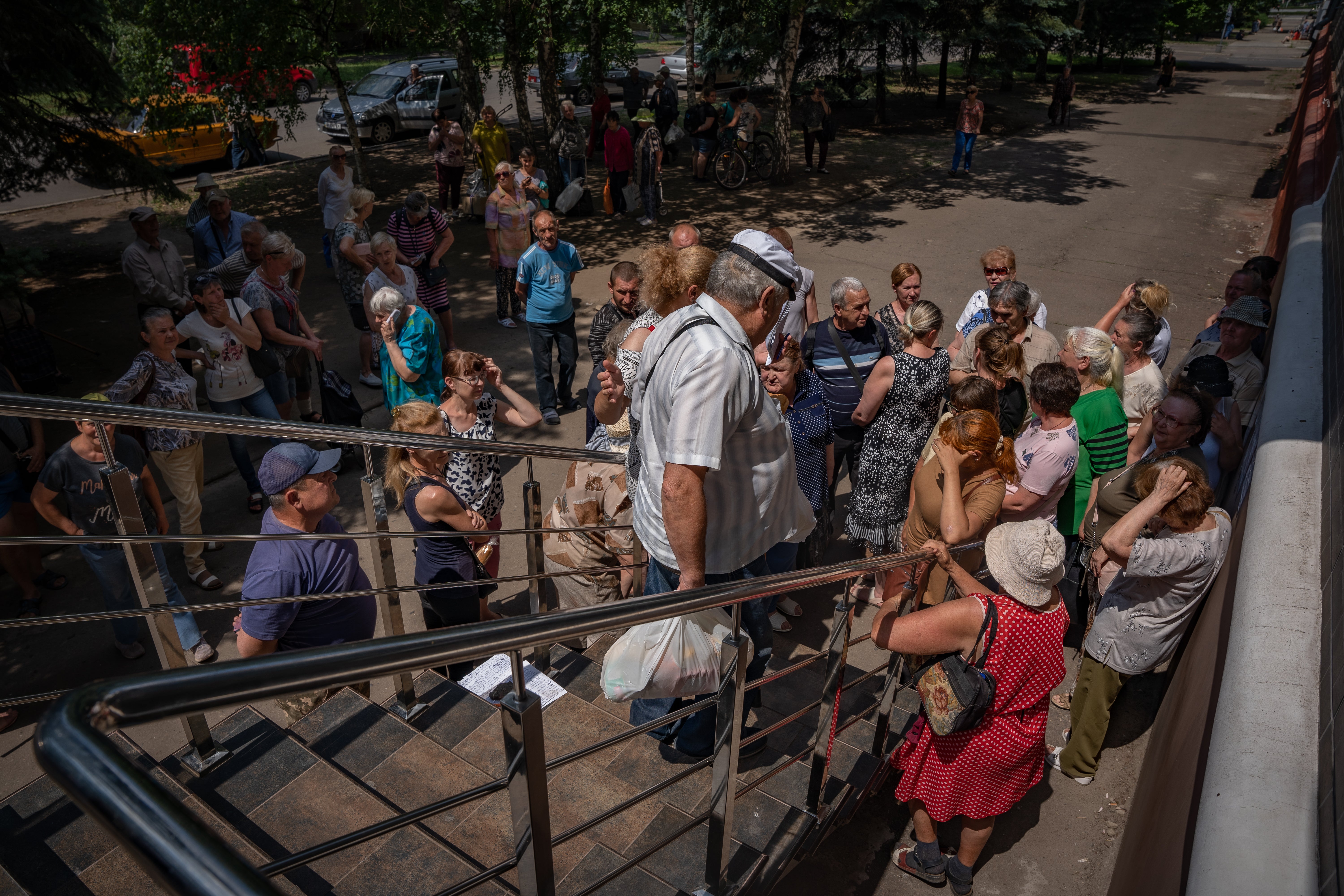 Civilians, most of them elderly, wait days for aid handouts as food prices have soared