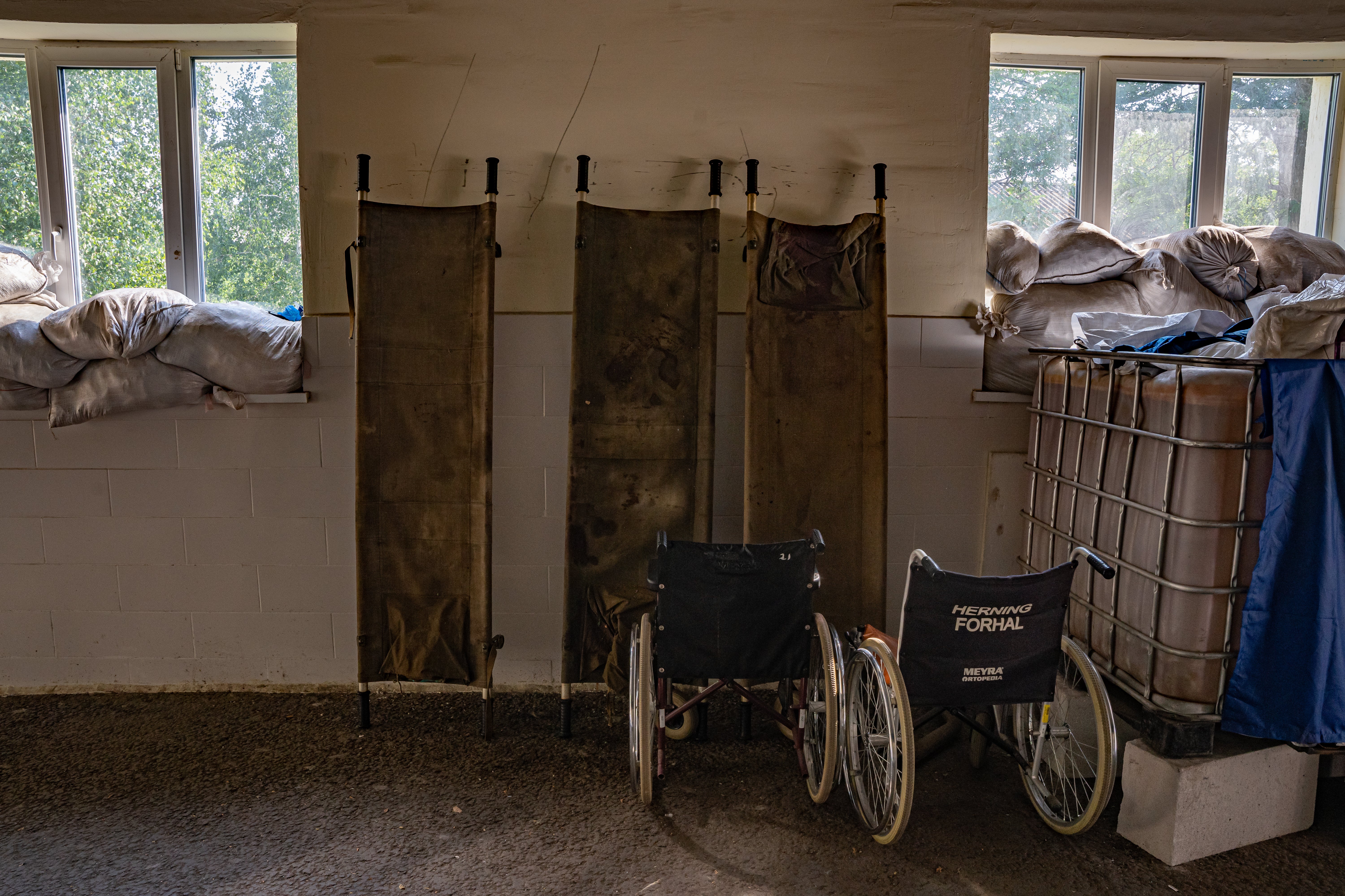 Bloodstained stretchers propped up against a wall in Kramatorsk hospital