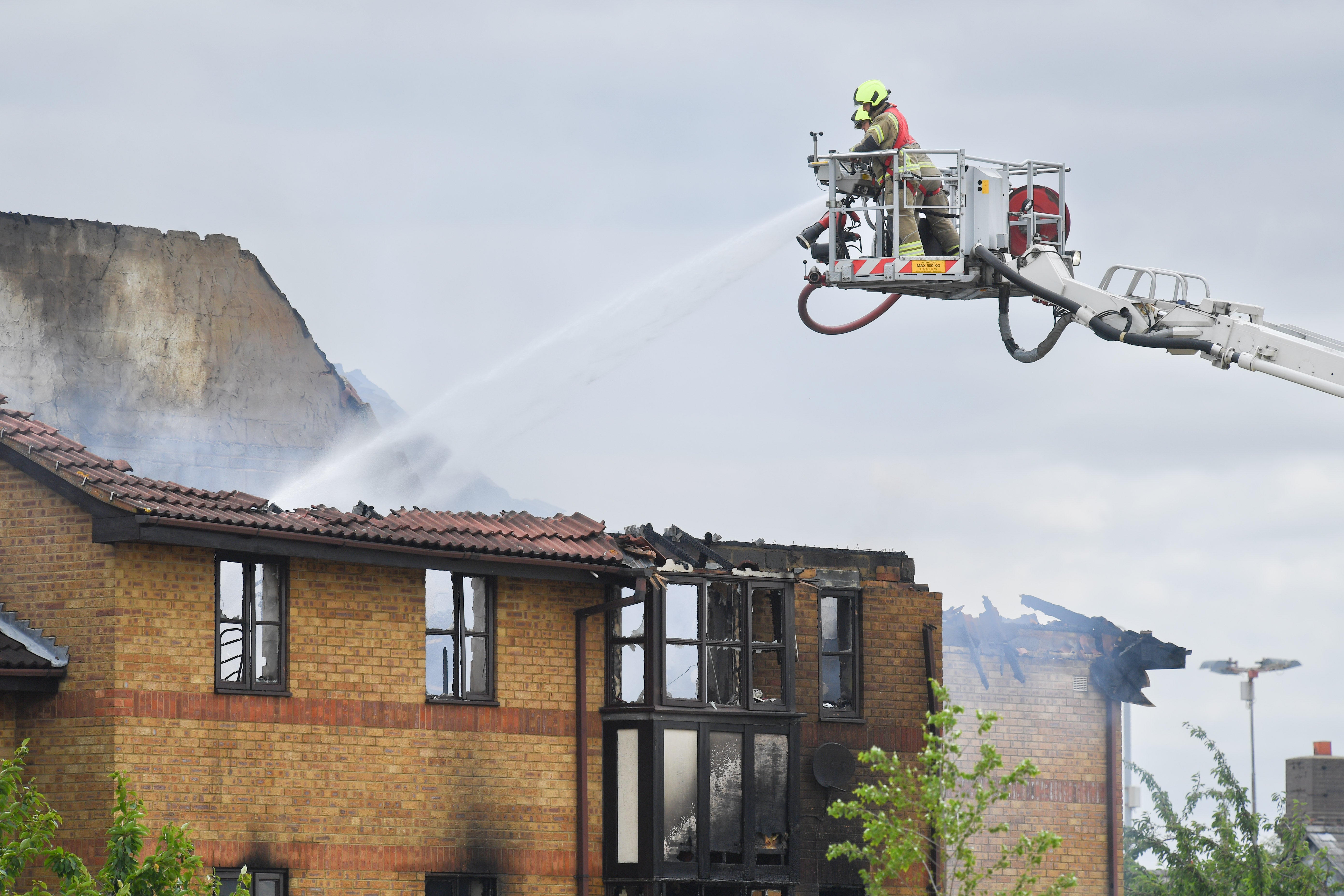 Firefighters at the scene of fire in Redwood Grove, Bedford