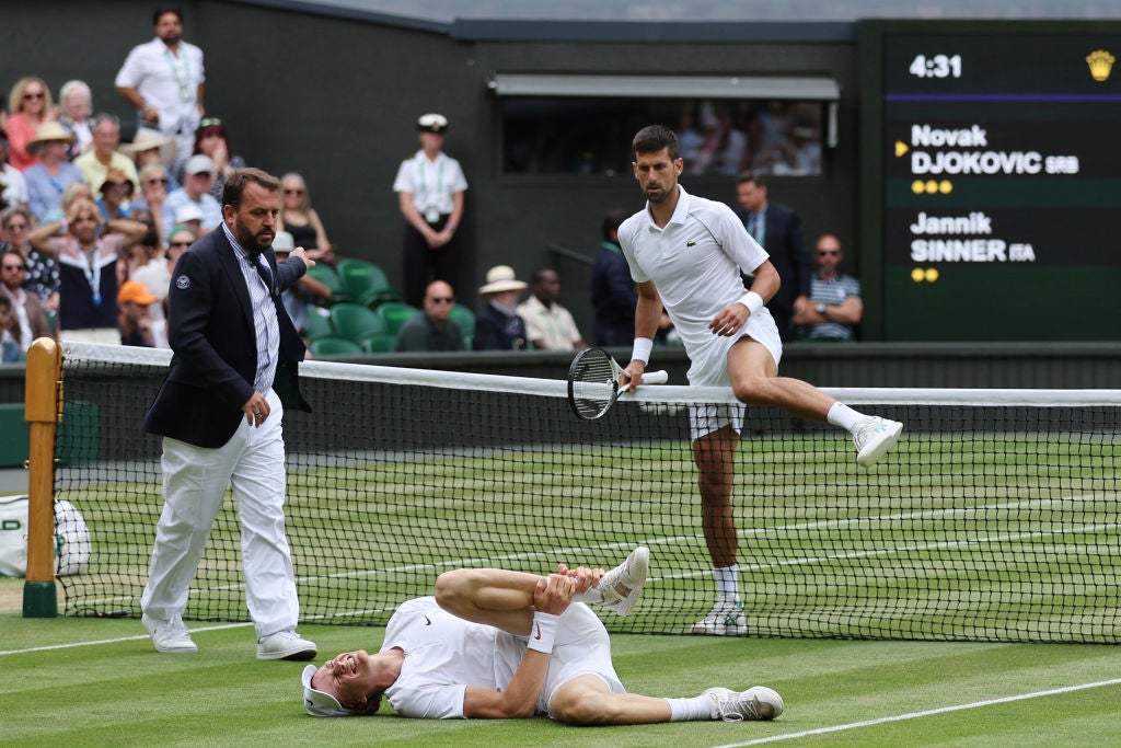 Man down: Djokovic comes to the aid of Sinner