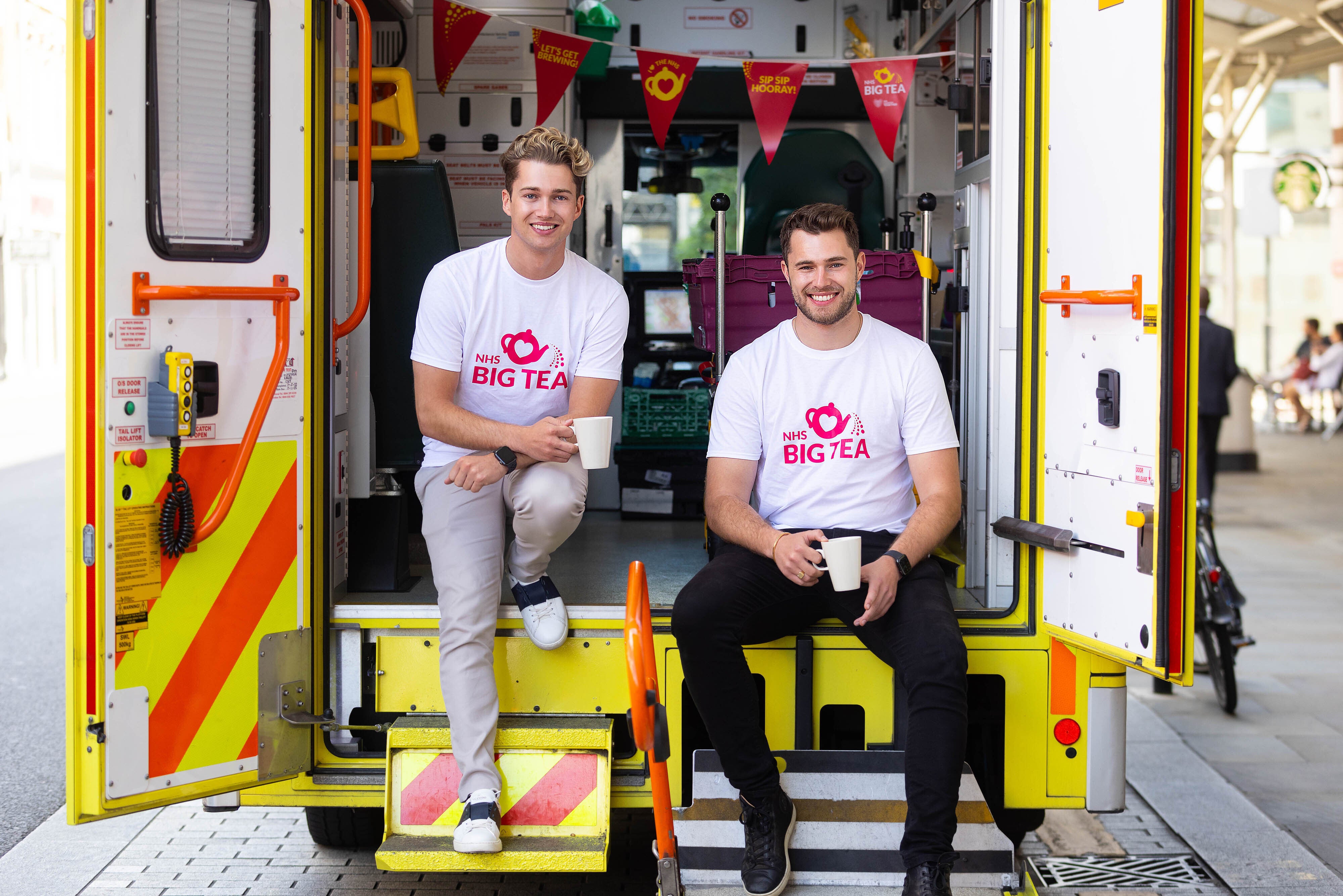 Curtis and AJ Pritchard celebrate 74th birthday of NHS by surprising staff and patients (David Parry/PA)