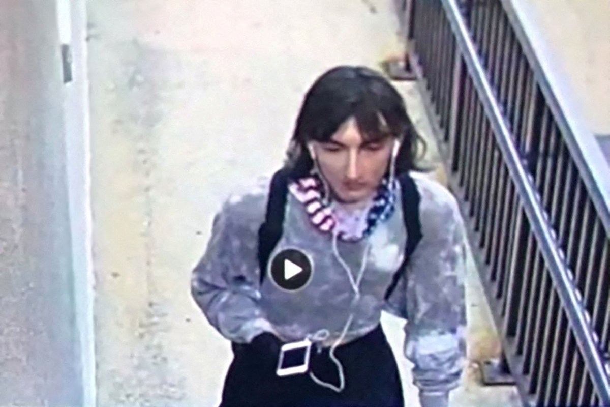 Surveillance image of what police believe to be is Robert E Crimo dressed in women’s clothing