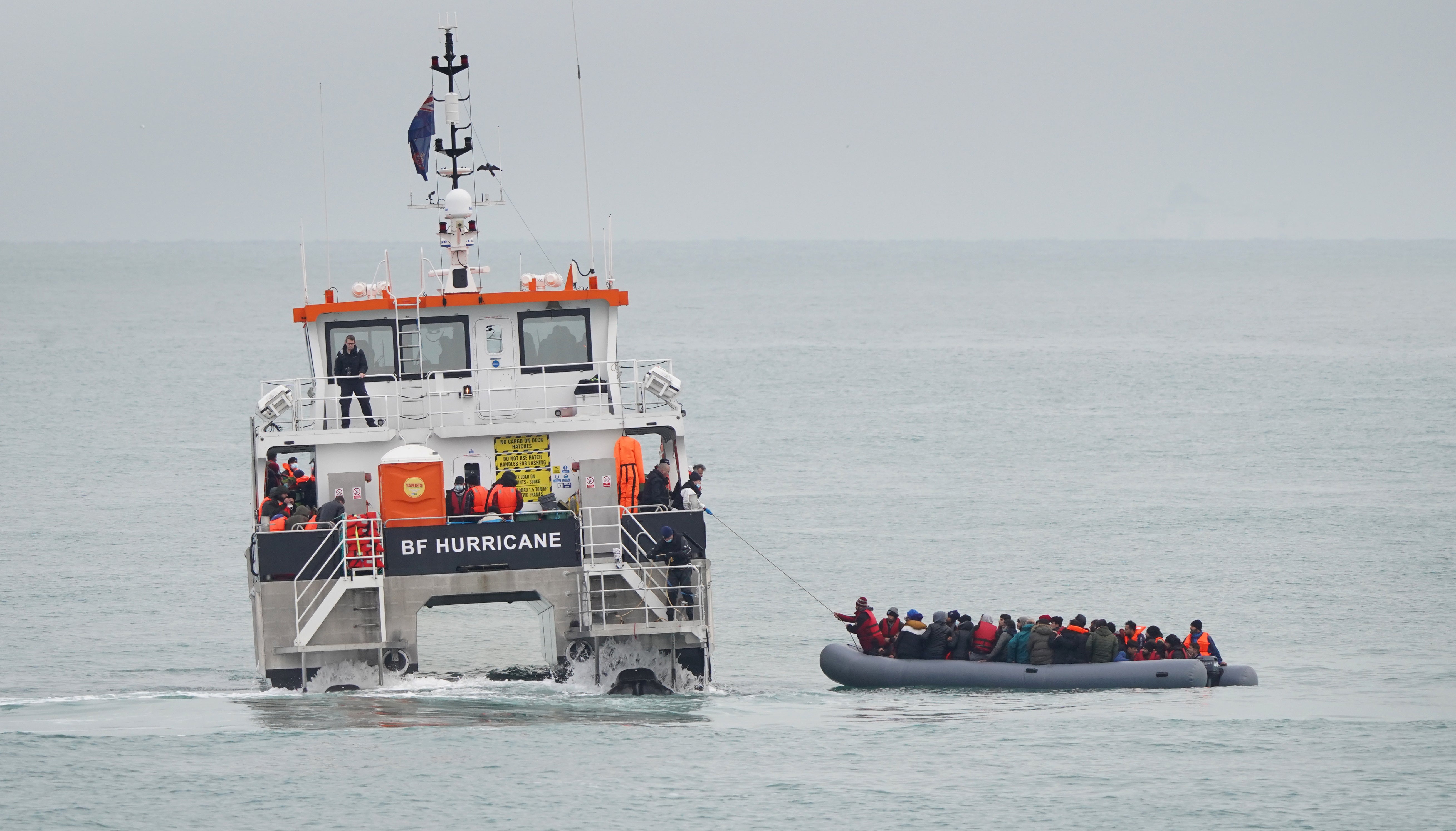 A group of people thought to be migrants off the coast of Folkestone (Gareth Fuller/PA)