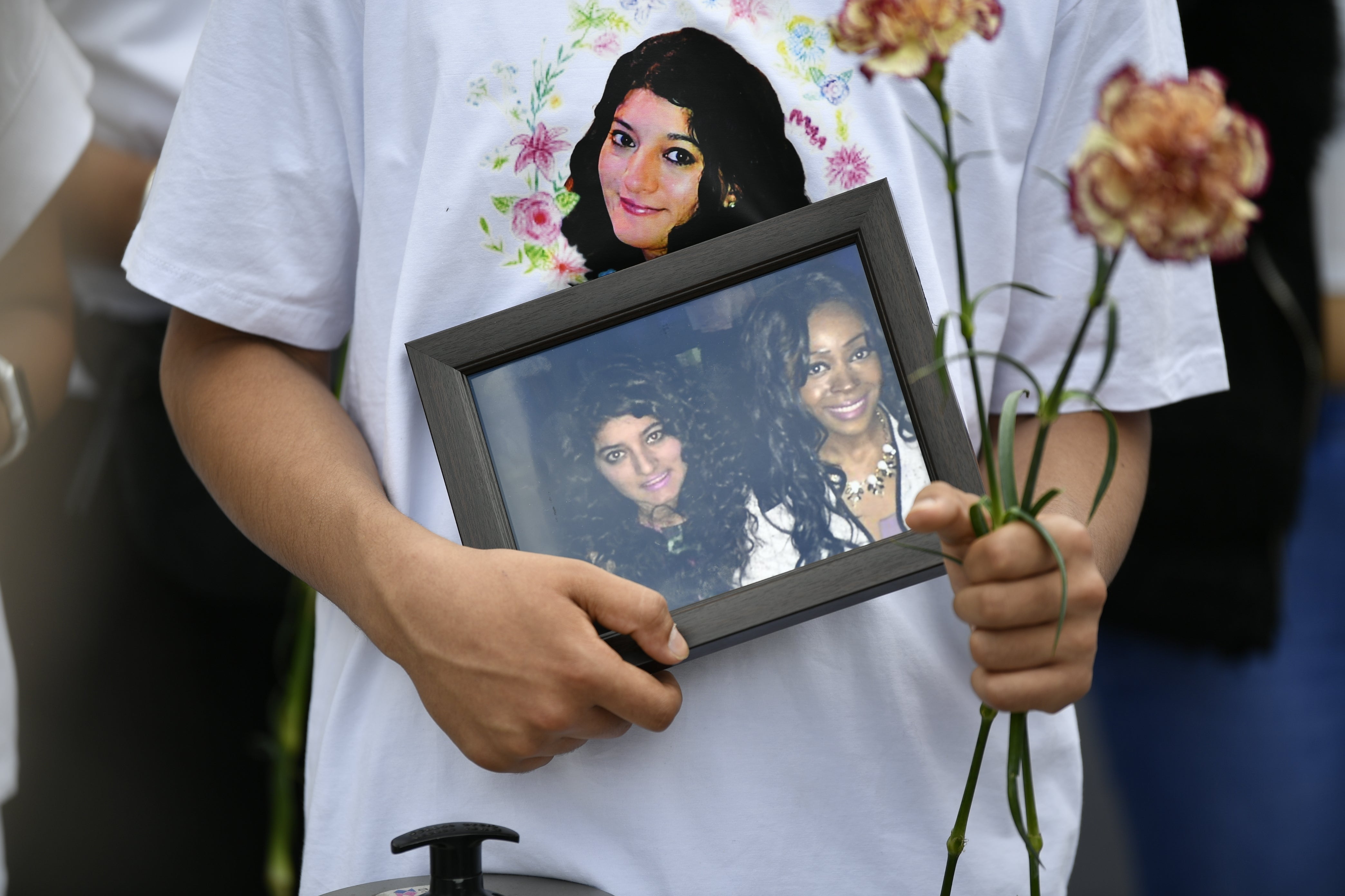 Family and friends with members of the public attend a vigil in Ilford, east London, for Zara Aleena