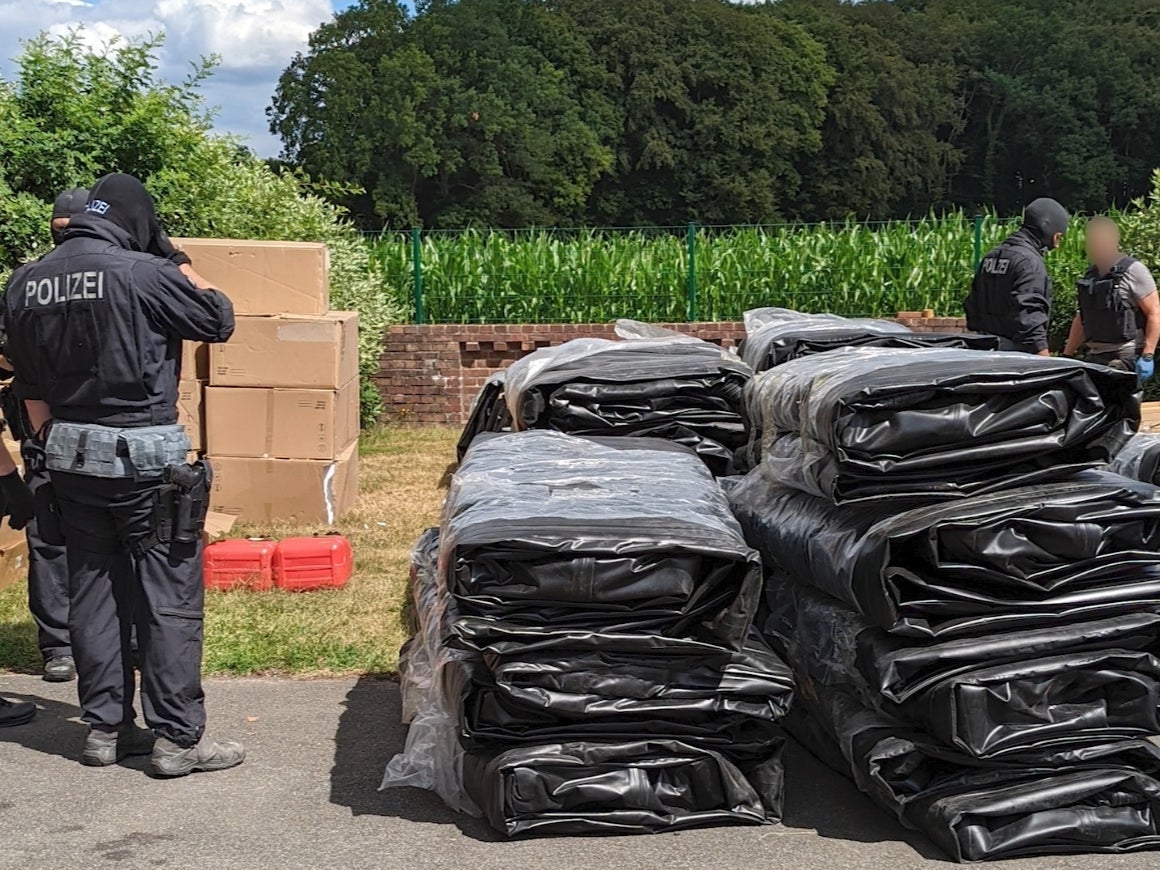 Inflatable boats purchased by a people smuggling network being seized on a farm near Osnabruck, Germany, on 5 July 2022