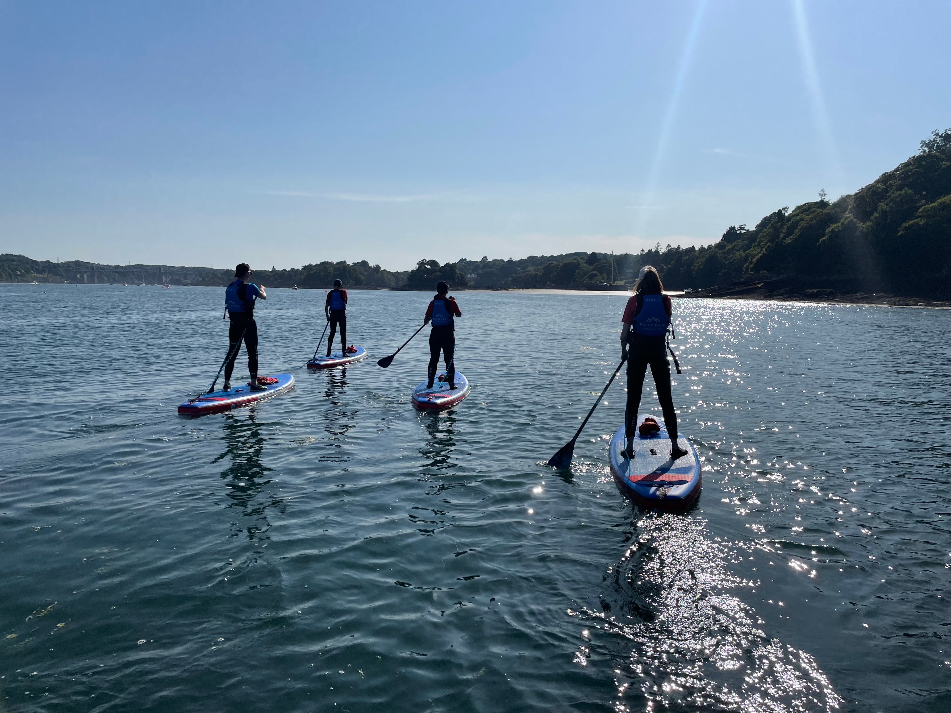 Paddleboard along the serene waters throughout both the day and night