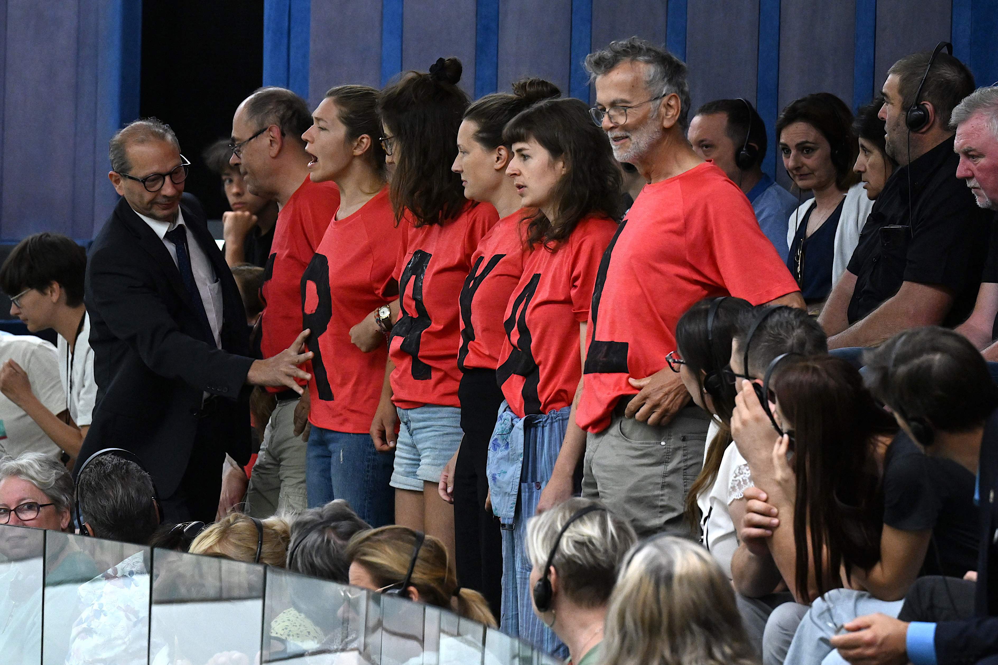 Demonstrators protest from the gallery as members of the European Parliament vote on allowing gas to be considered “sustainable.”