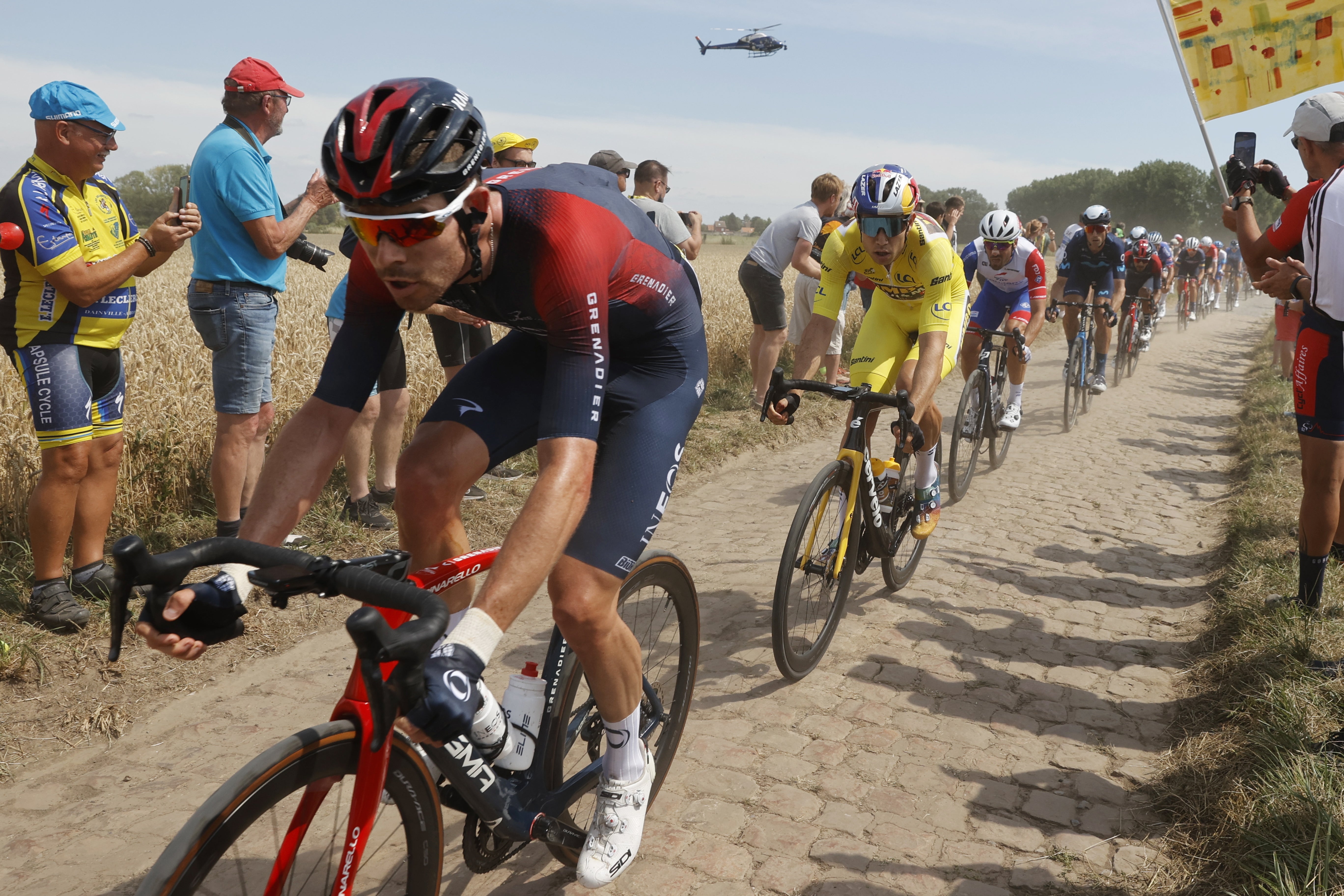 Wout van Aert, in yellow, on the cobbles of northern France