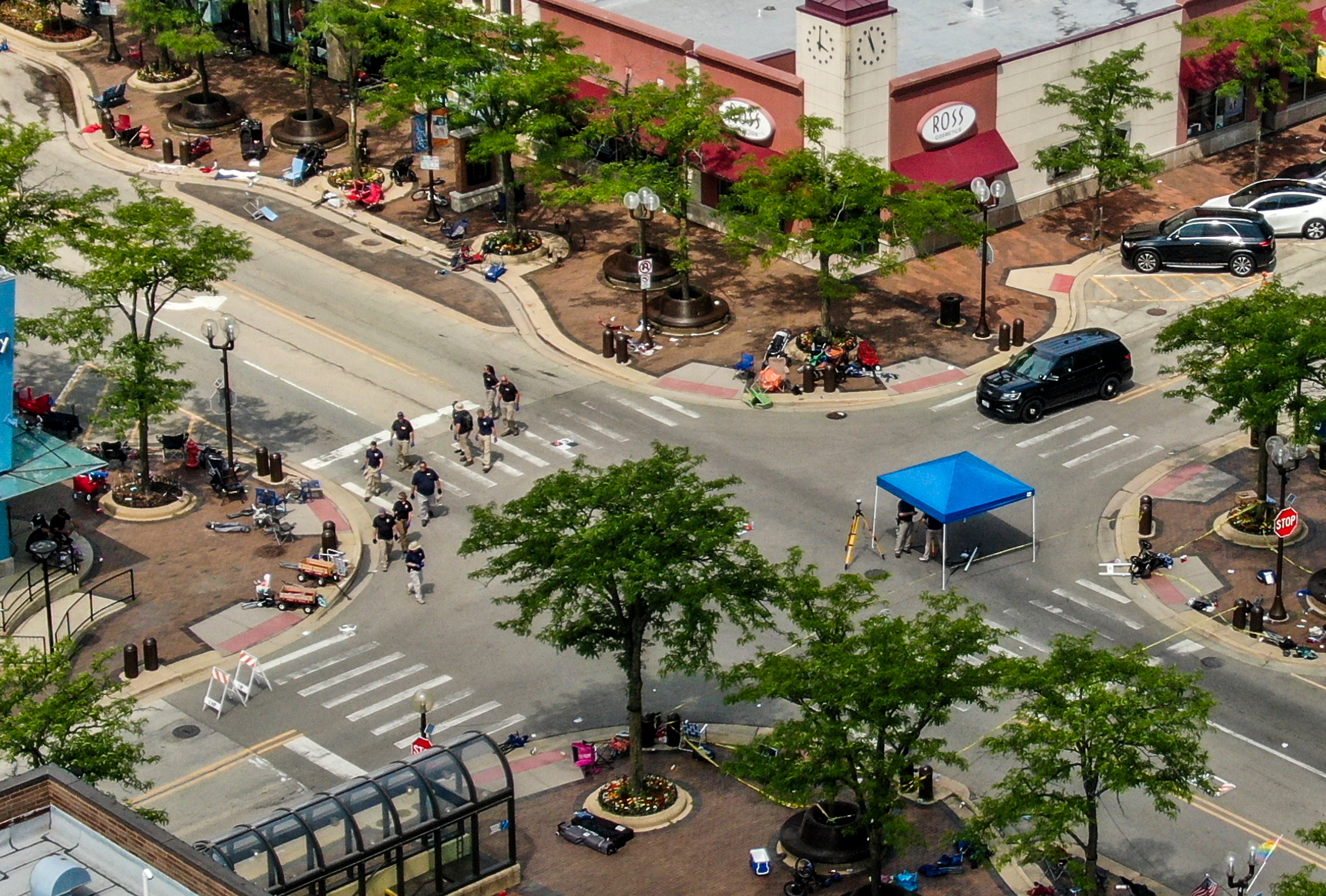 An aerial photo shows law enforcement officers investigating the scene of the July 4 shooting