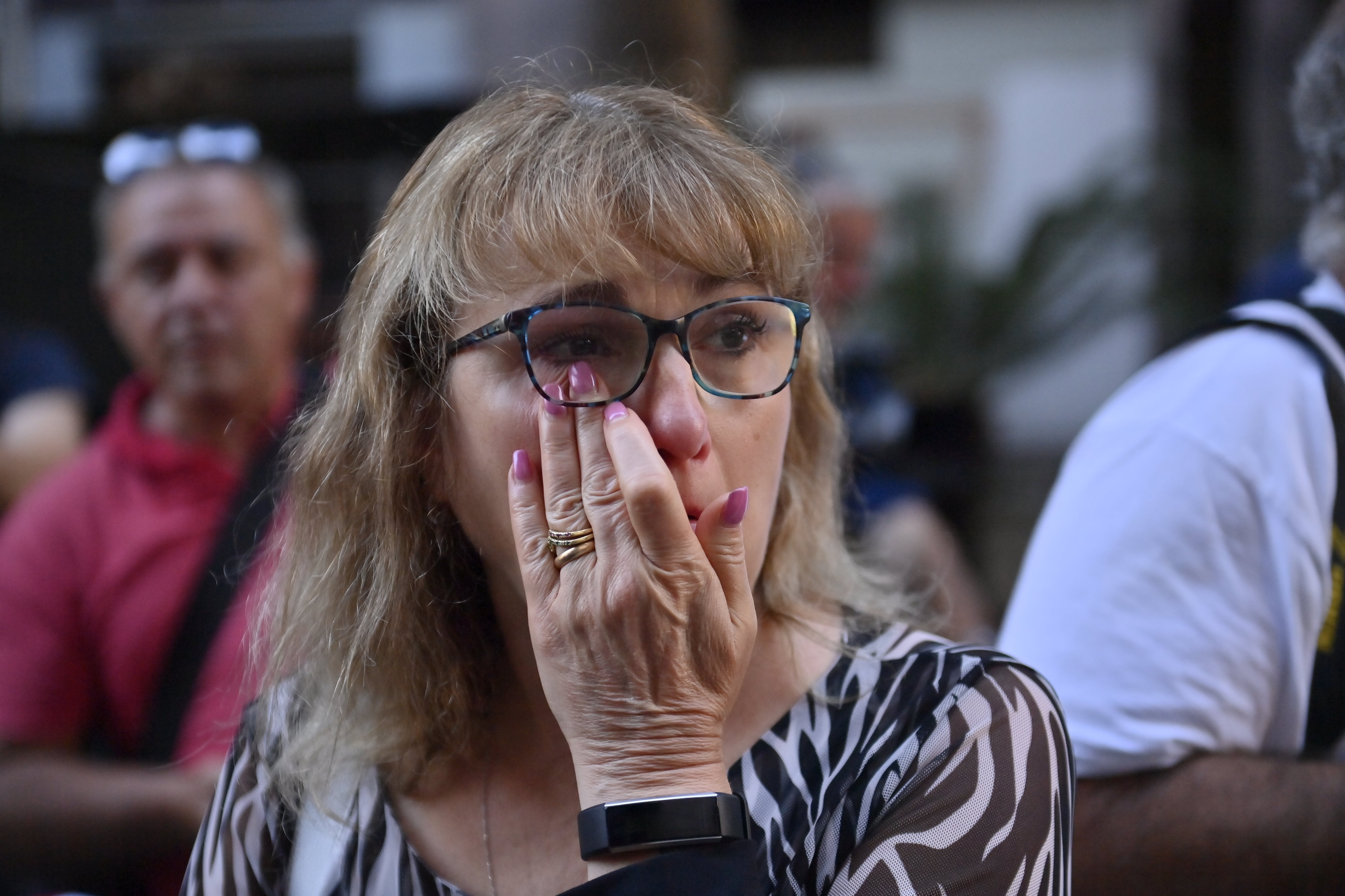 Maria Grazia LoNigro, mother of the victim Luigi Matti Altadonna, cries outside the court
