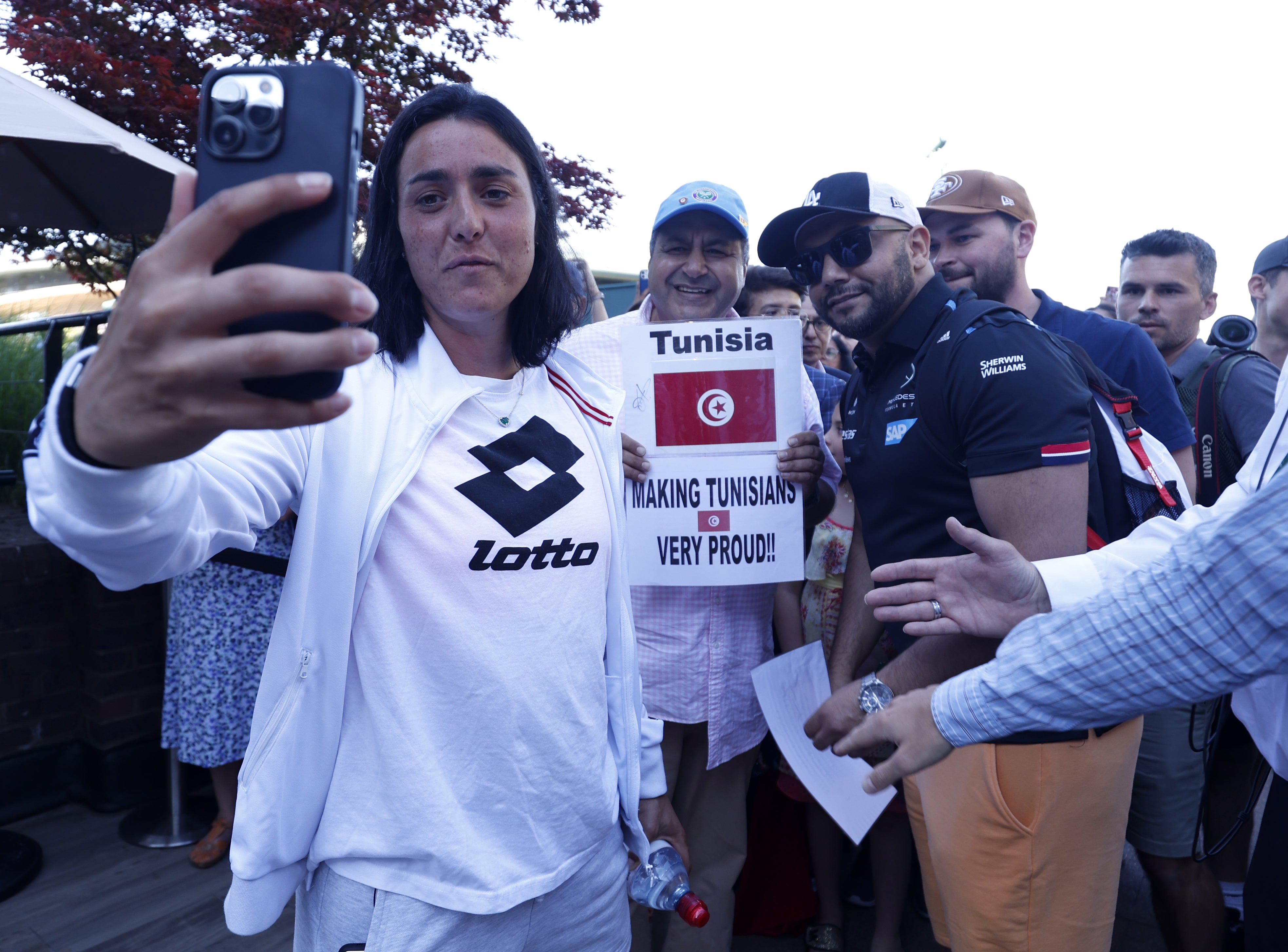 Ons Jabeur makes a video message with her fans after her semi-final win (Steven Paston/PA)