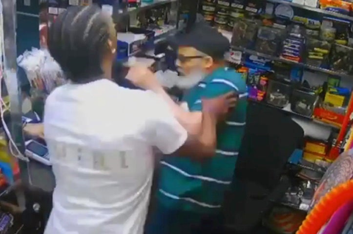 Austin Simon is seen shoving bodega worker Jose Alba at the start of the altercation