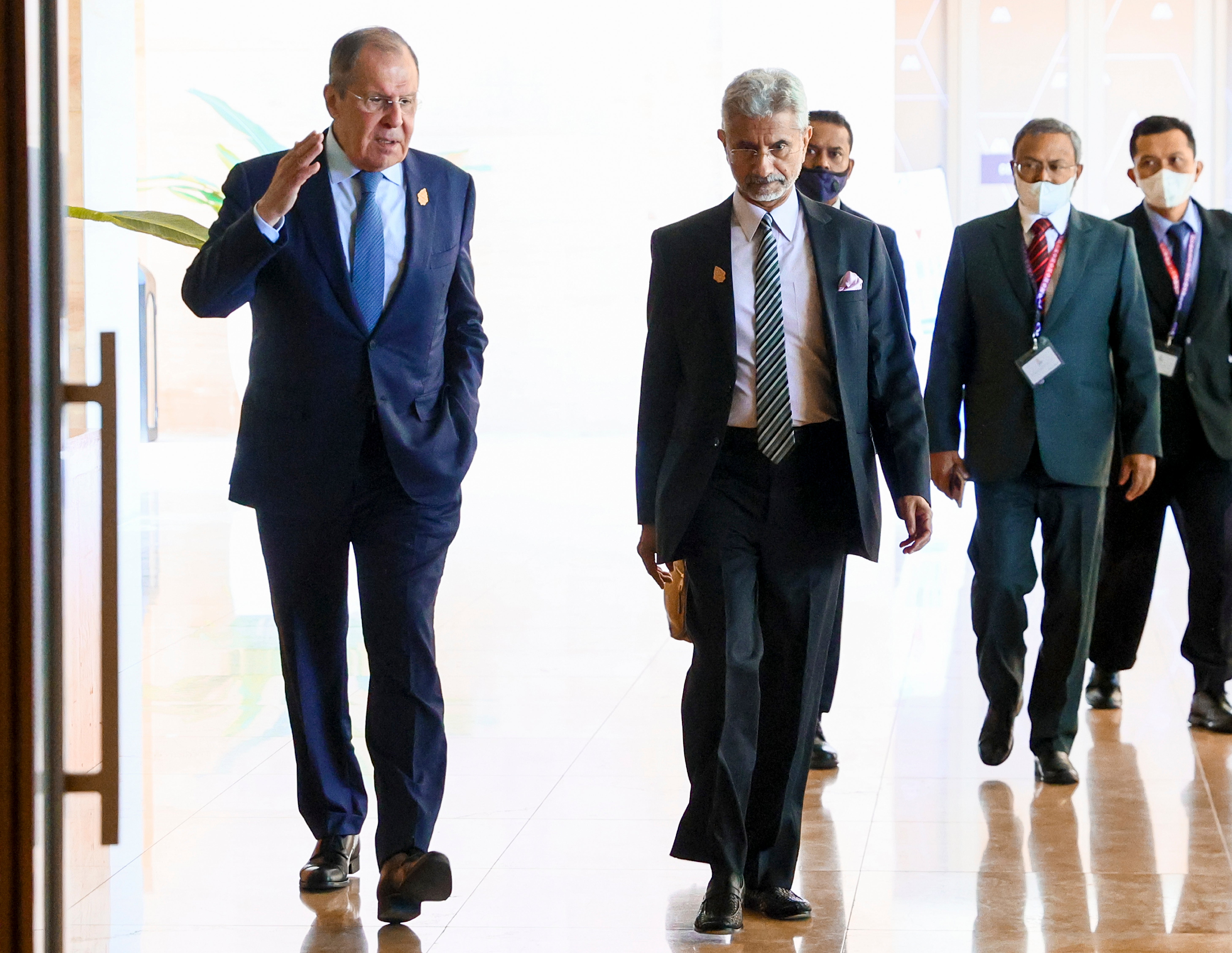 Russia’s Sergei Lavrov and India’s Subrahmanyam Jaishankar walk together during their bilateral meeting ahead of the G20 foreign ministers’ meeting in Bali on Friday