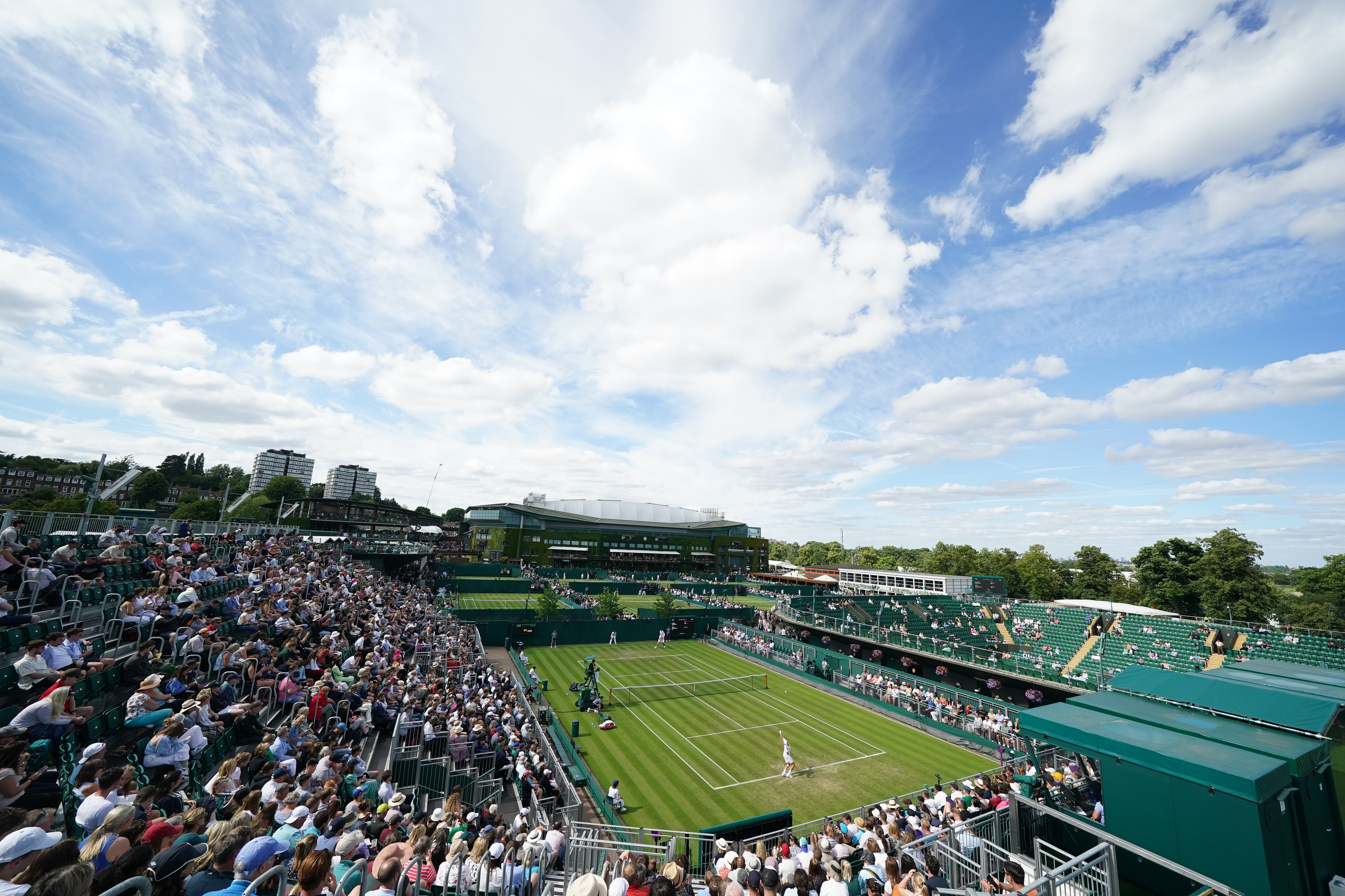 Fans were taking in some early tennis action on a glorious Friday morning at Wimbledon (Adam Davy/PA)