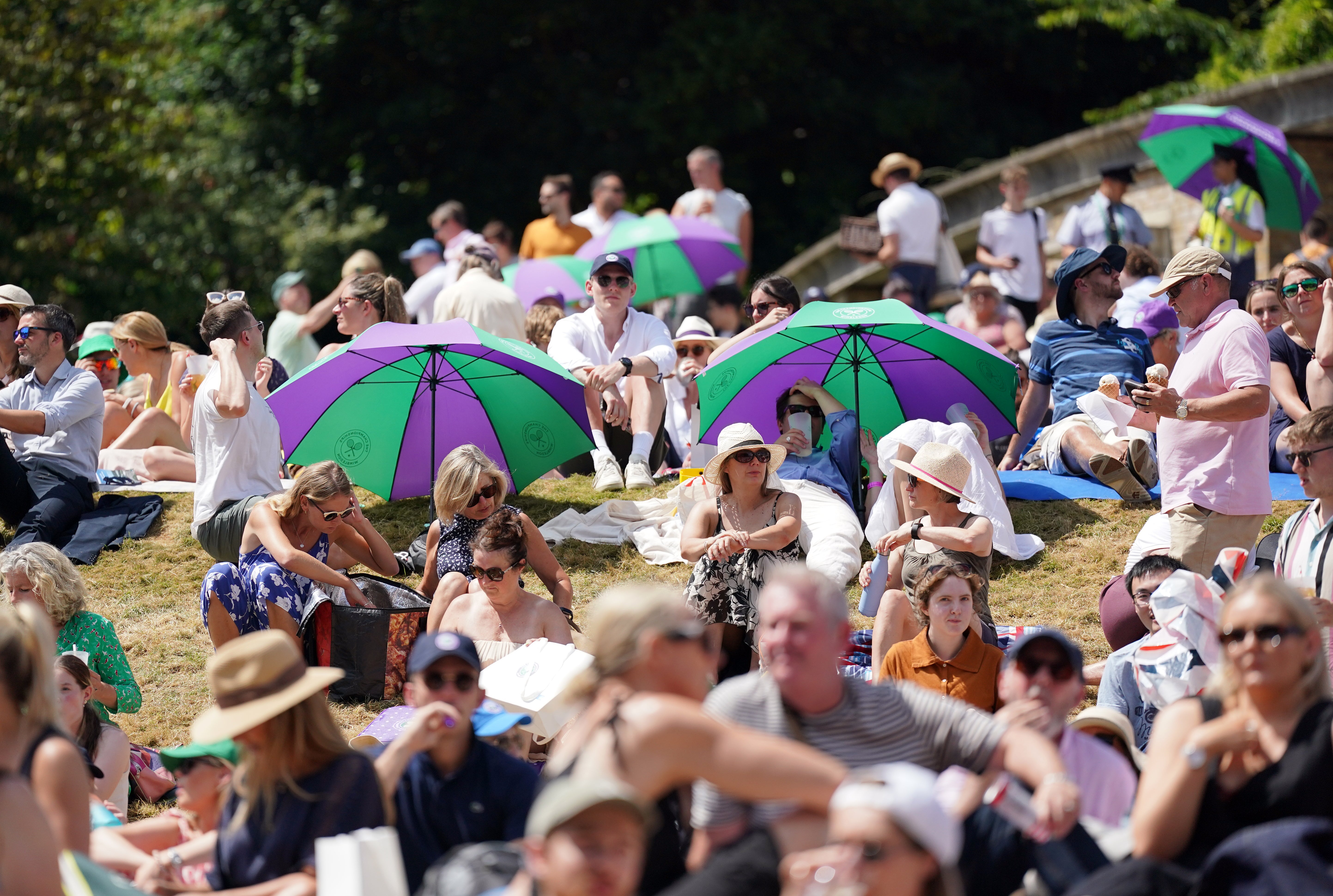 Spectators claimed their places on Henman Hill early (Zac Goodwin/PA)