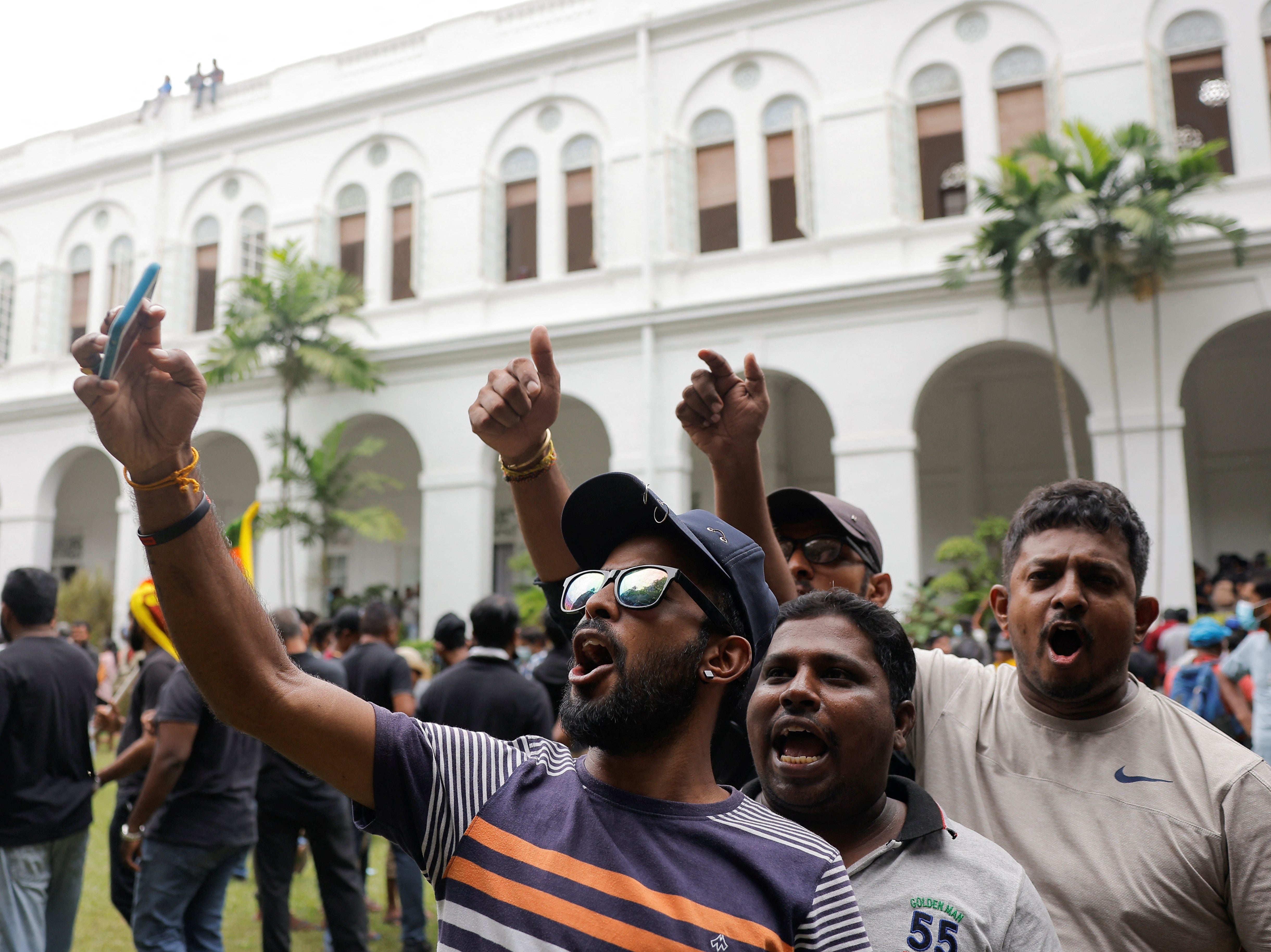 Demonstrators protest inside the presidential palace after it was stormed on Saturday