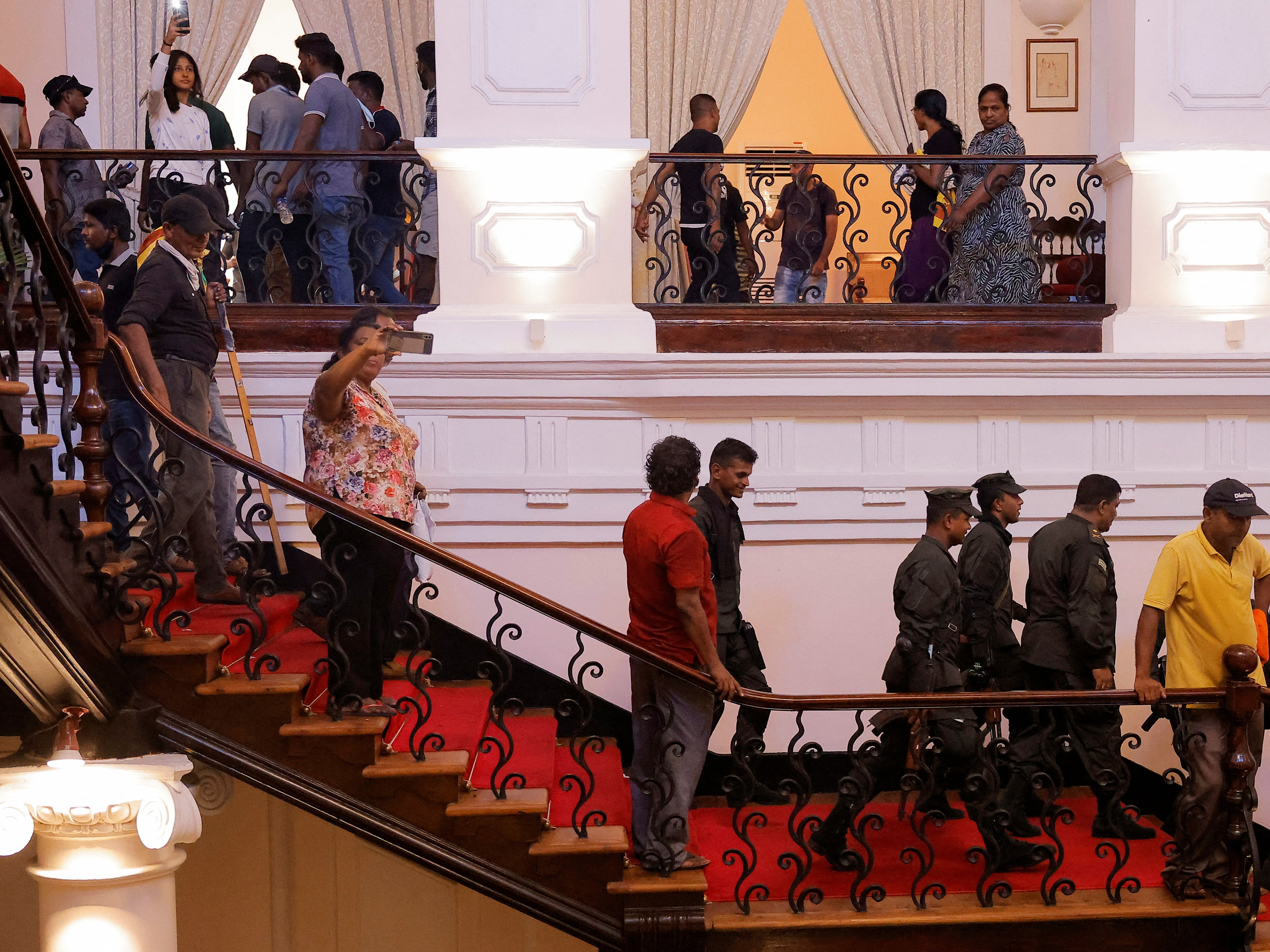 Protesters took pictures after entering the president’s house