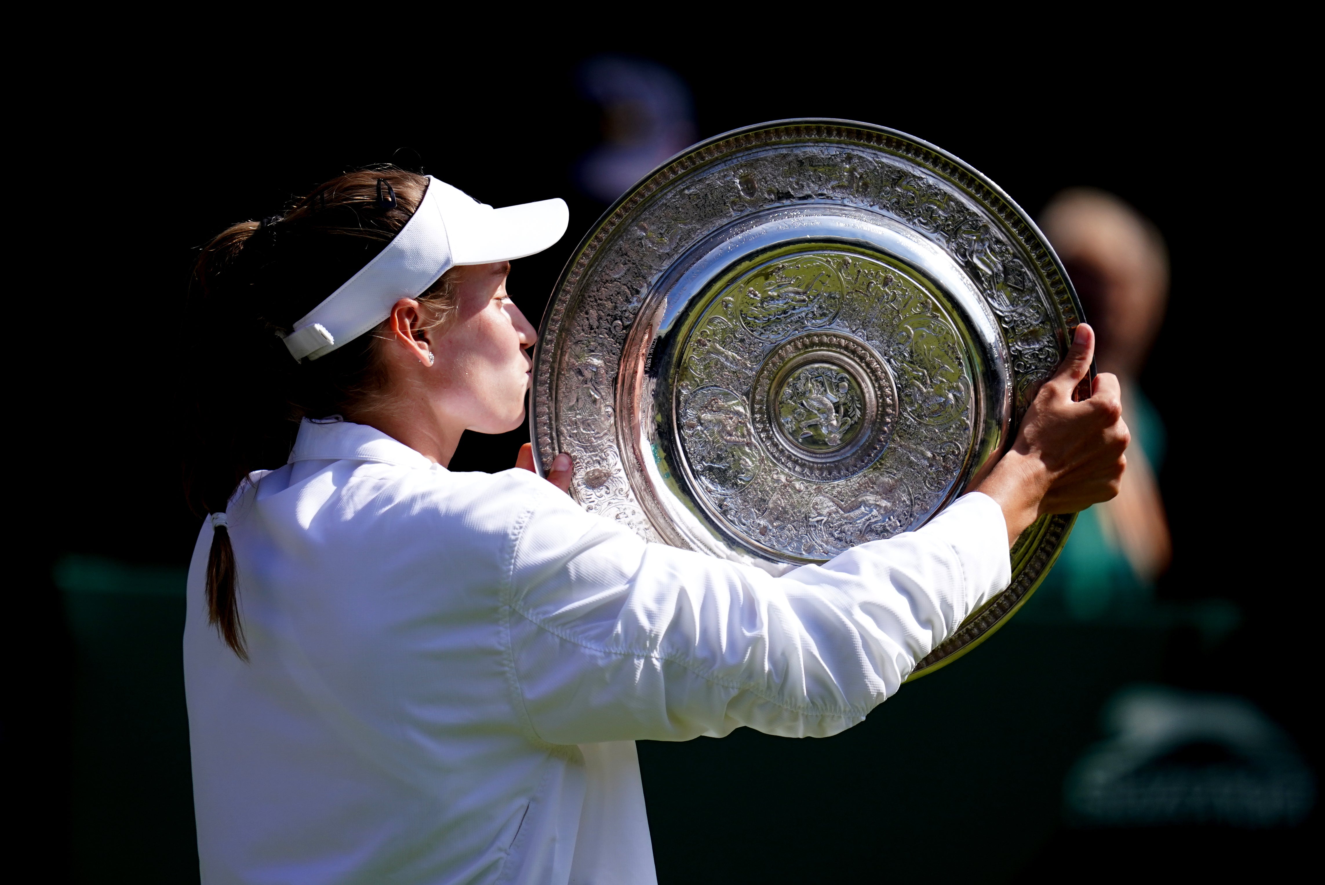 Elena Rybakina celebrates with the the Venus Rosewater Dish (John Walton/PA)